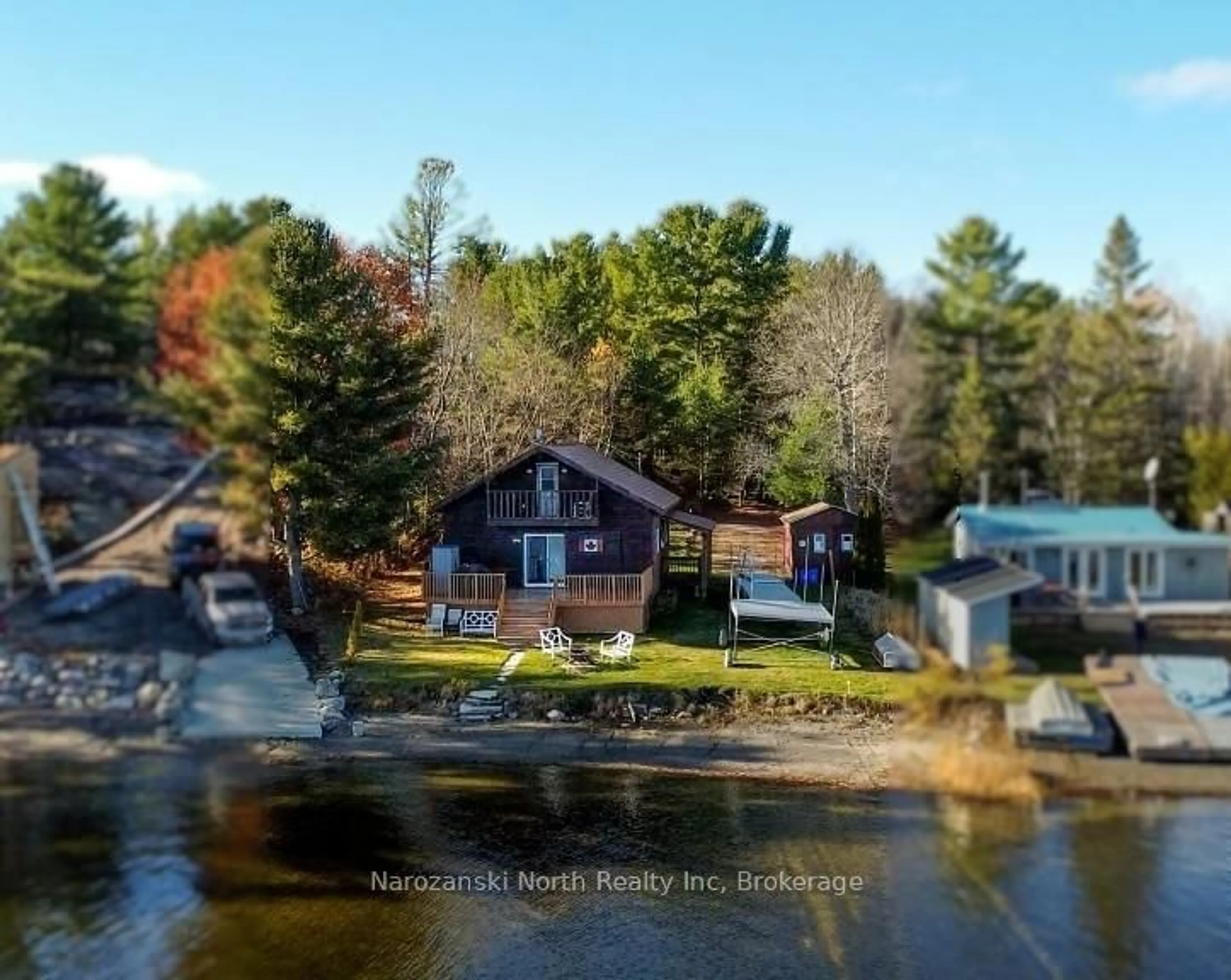 A pic from outside/outdoor area/front of a property/back of a property/a pic from drone, water/lake/river/ocean view for 100 C Whippoorwill Rd, French River Ontario P0M 1A0