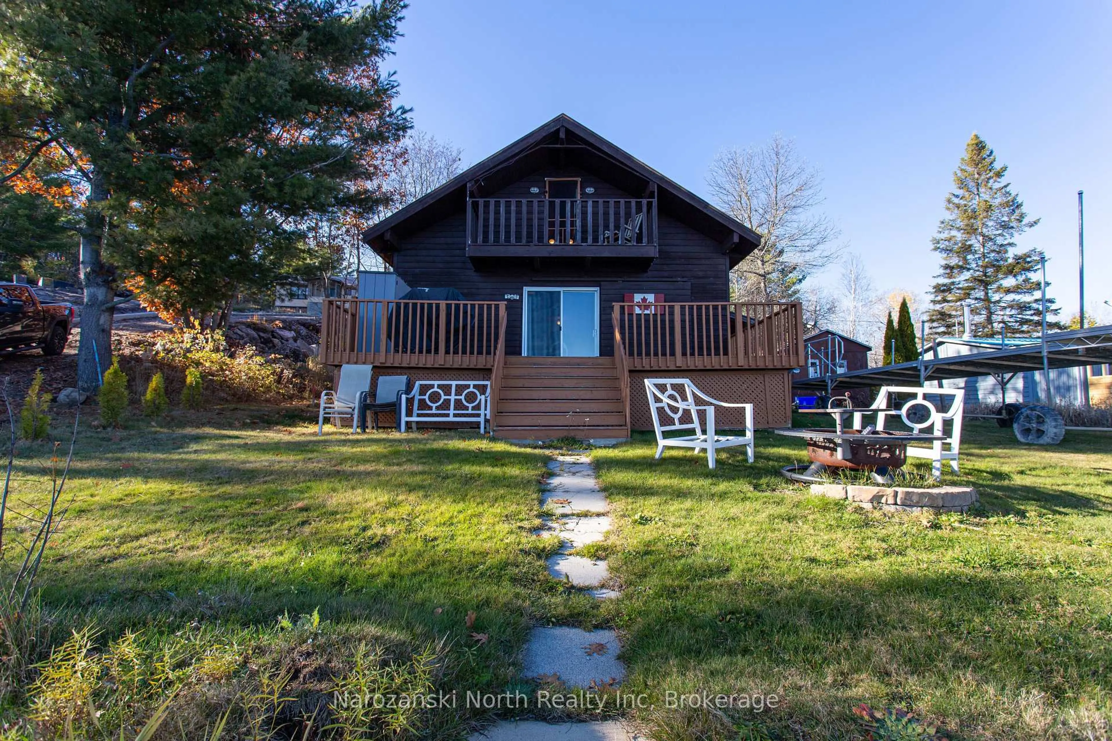 A pic from outside/outdoor area/front of a property/back of a property/a pic from drone, water/lake/river/ocean view for 100 C Whippoorwill Rd, French River Ontario P0M 1A0