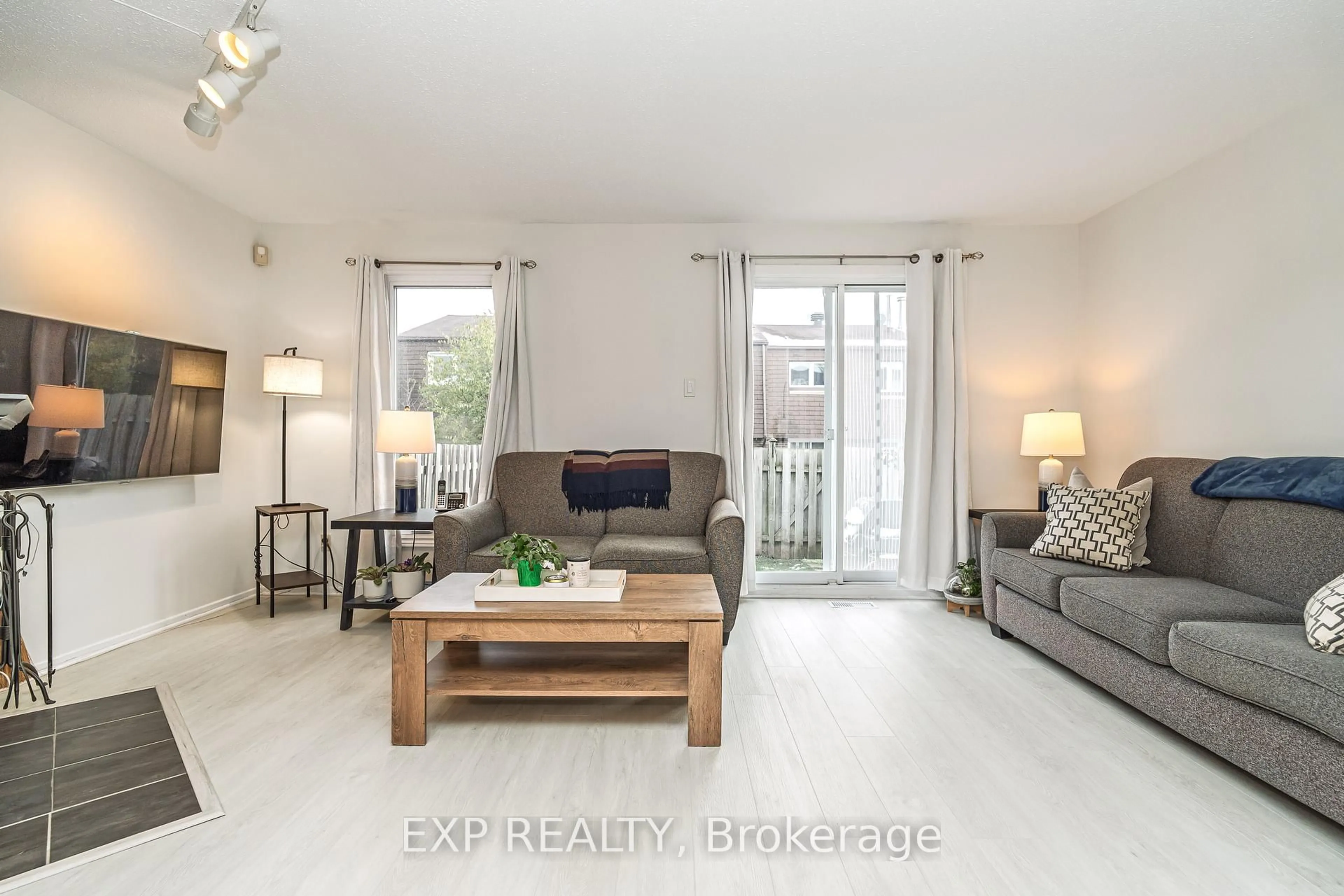 Living room with furniture, wood/laminate floor for 3333 Mccarthy Rd #25, Ottawa Ontario K1V 9X5