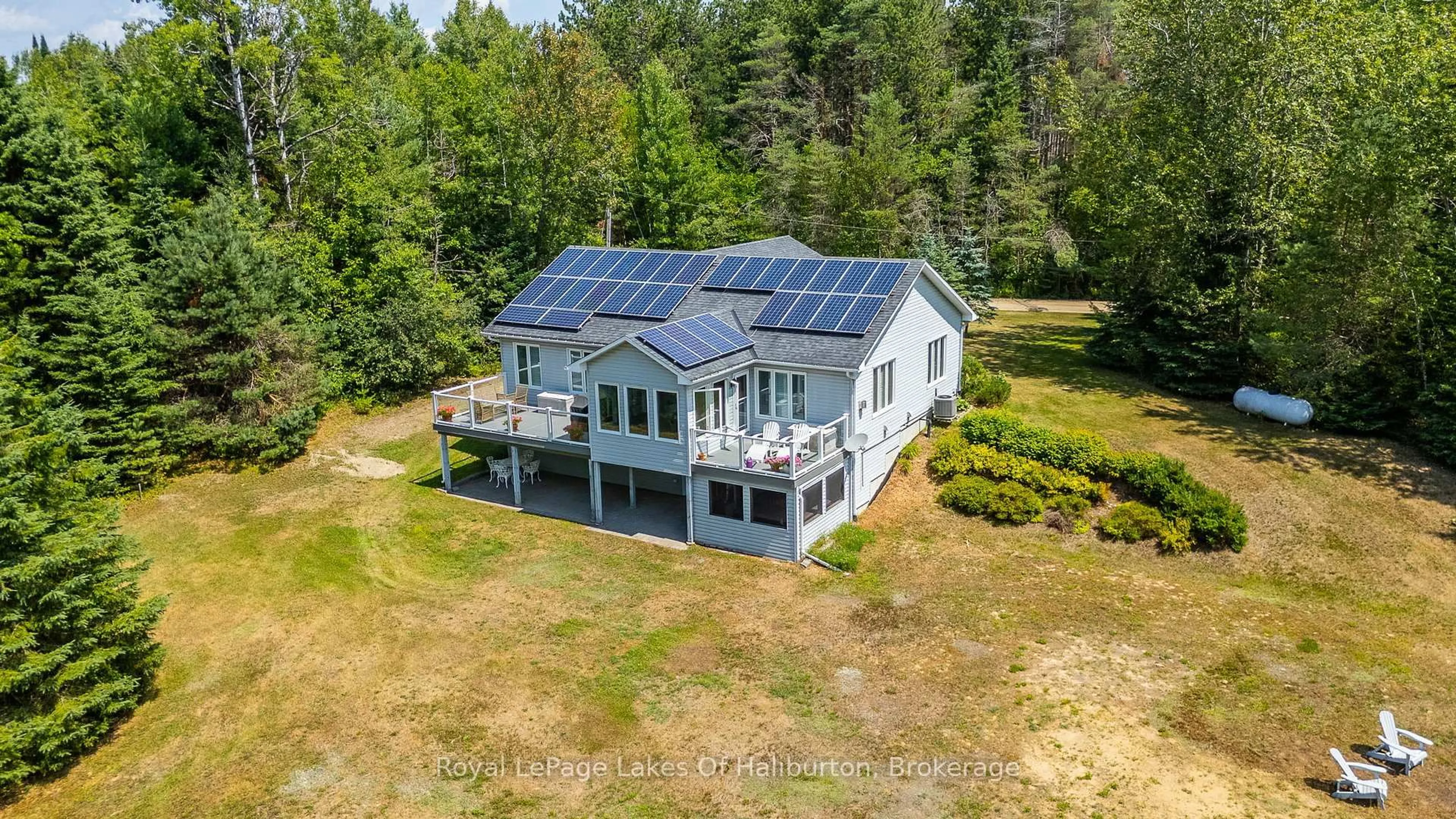 A pic from outside/outdoor area/front of a property/back of a property/a pic from drone, water/lake/river/ocean view for 1030 Sawdust Rd, Minden Hills Ontario K0M 2K0