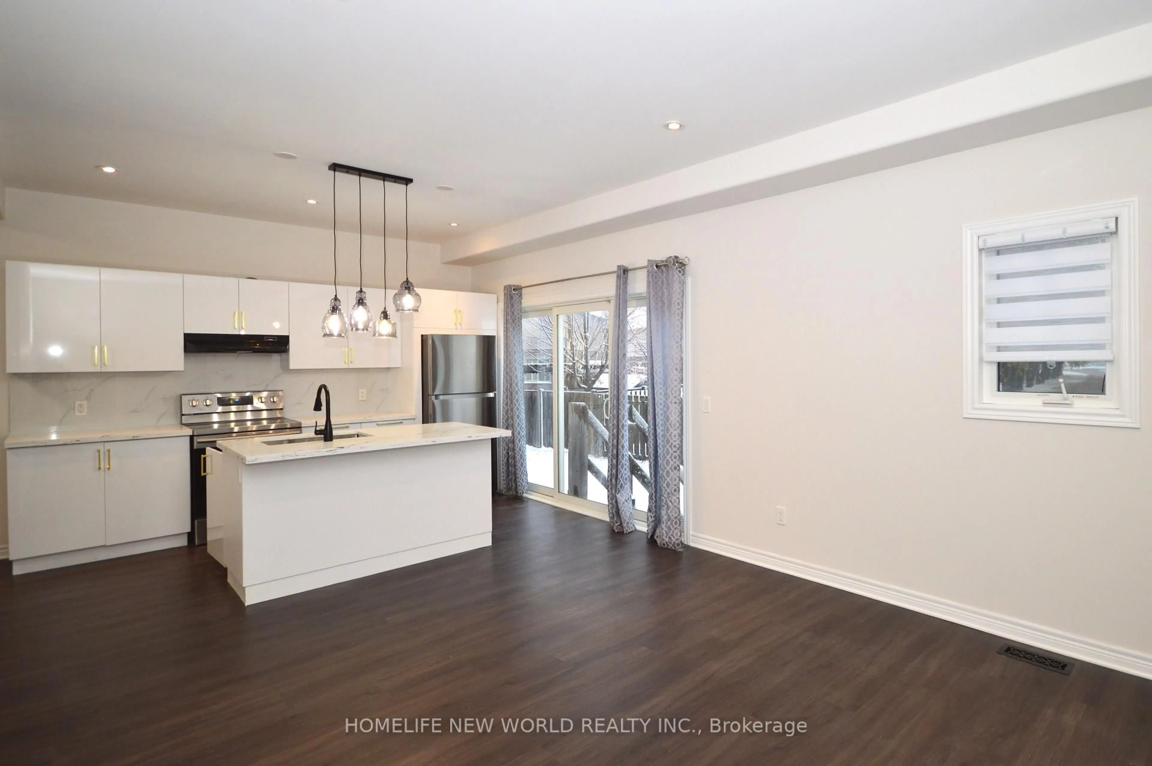 Open concept kitchen, wood/laminate floor for 5991 KATE Ave, Niagara Falls Ontario L2H 0M9