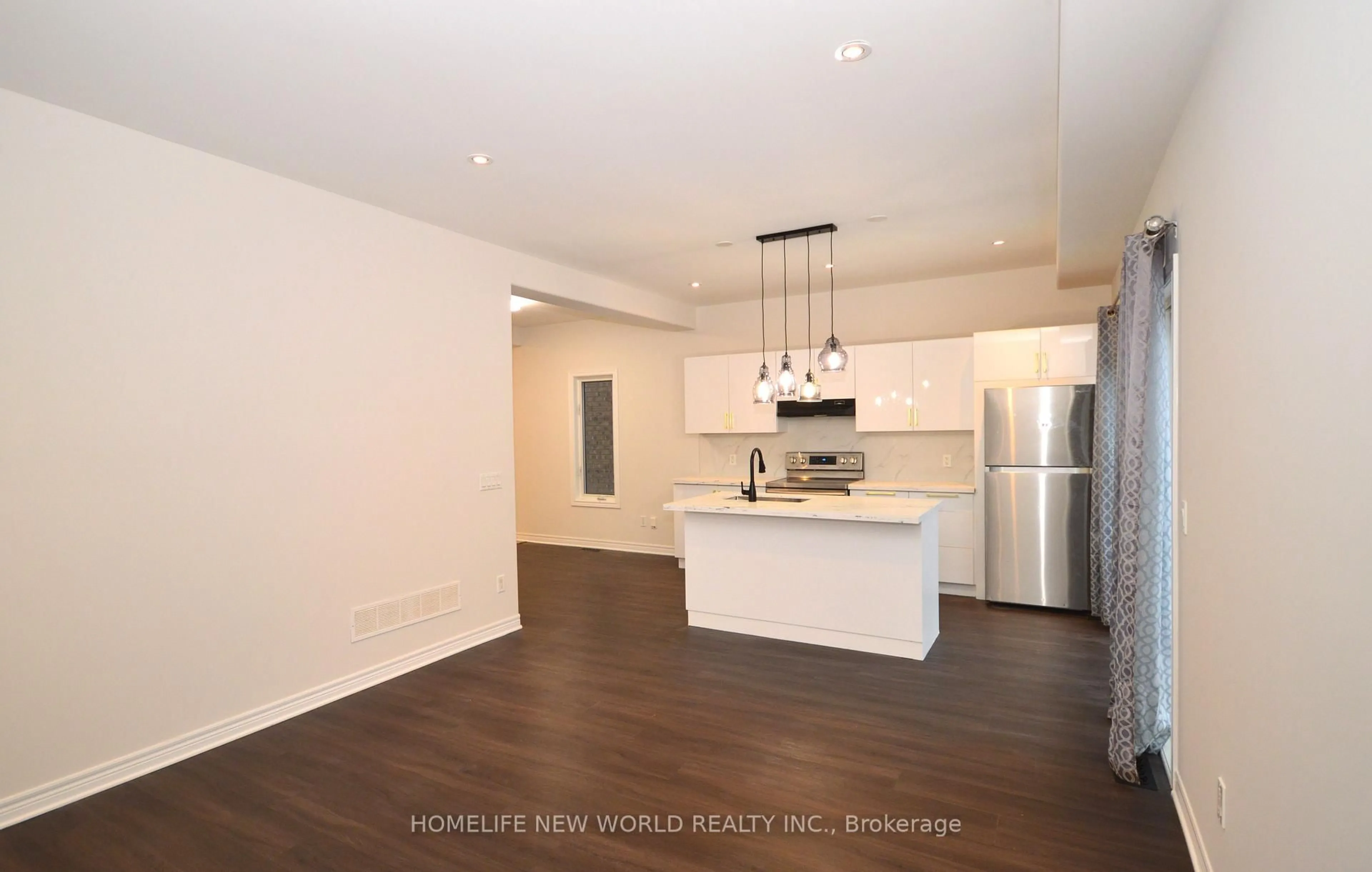 Open concept kitchen, wood/laminate floor for 5991 KATE Ave, Niagara Falls Ontario L2H 0M9