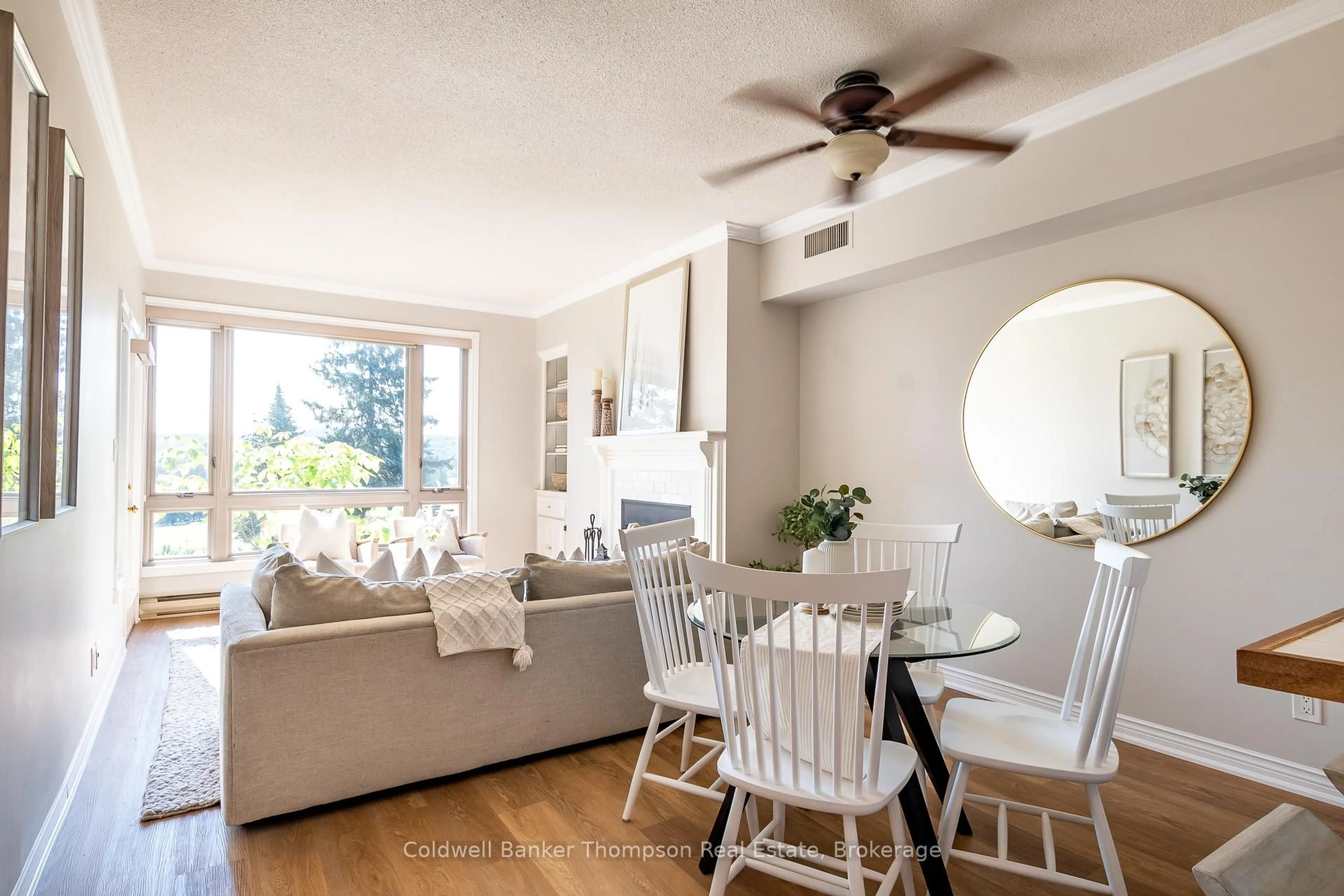 Living room with furniture, wood/laminate floor for 3311 Grandview Forest Hil Dr, Huntsville Ontario P1H 2J5