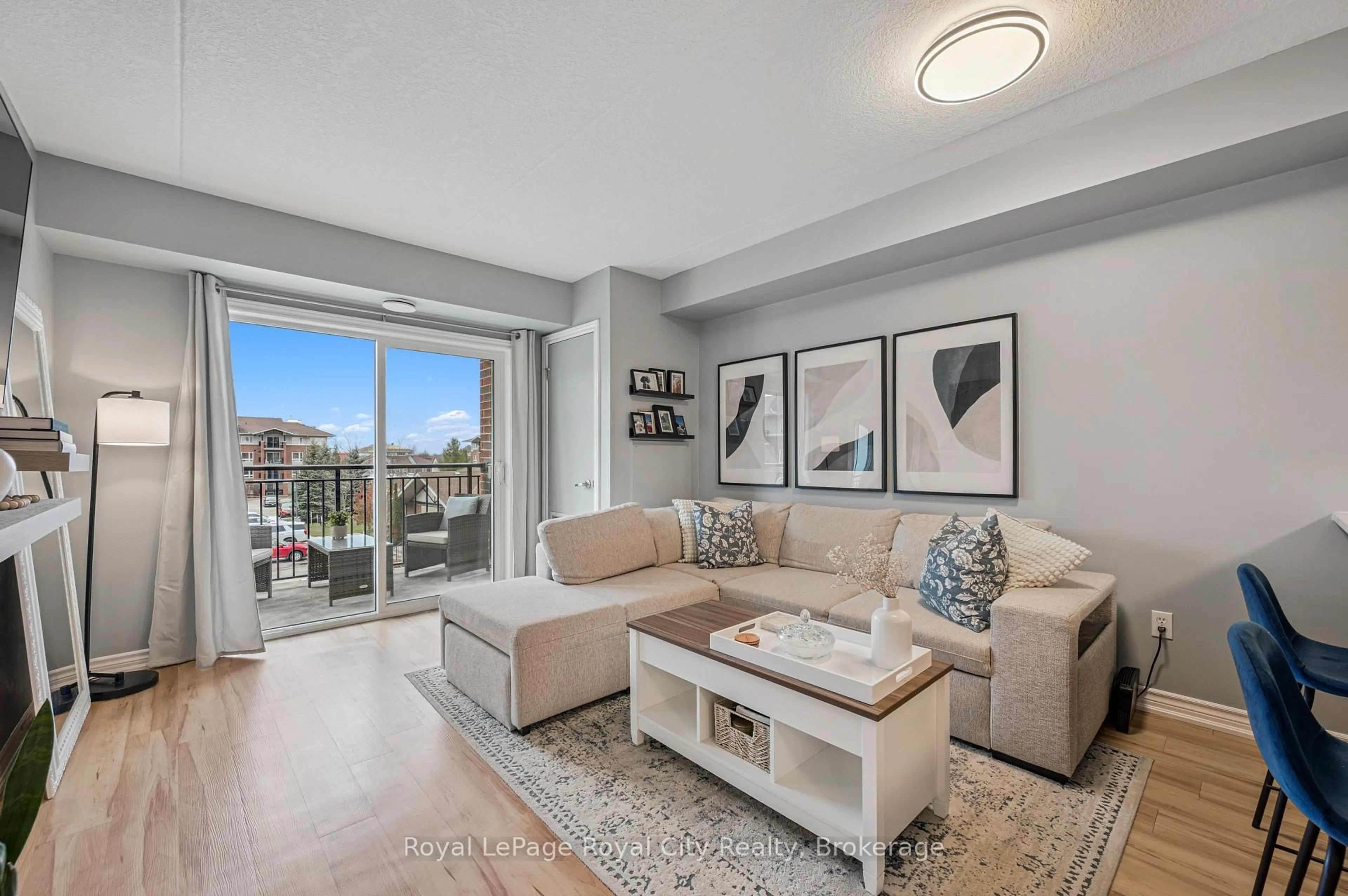 Living room with furniture, unknown for 41 Goodwin Dr #309, Guelph Ontario N1L 0E7