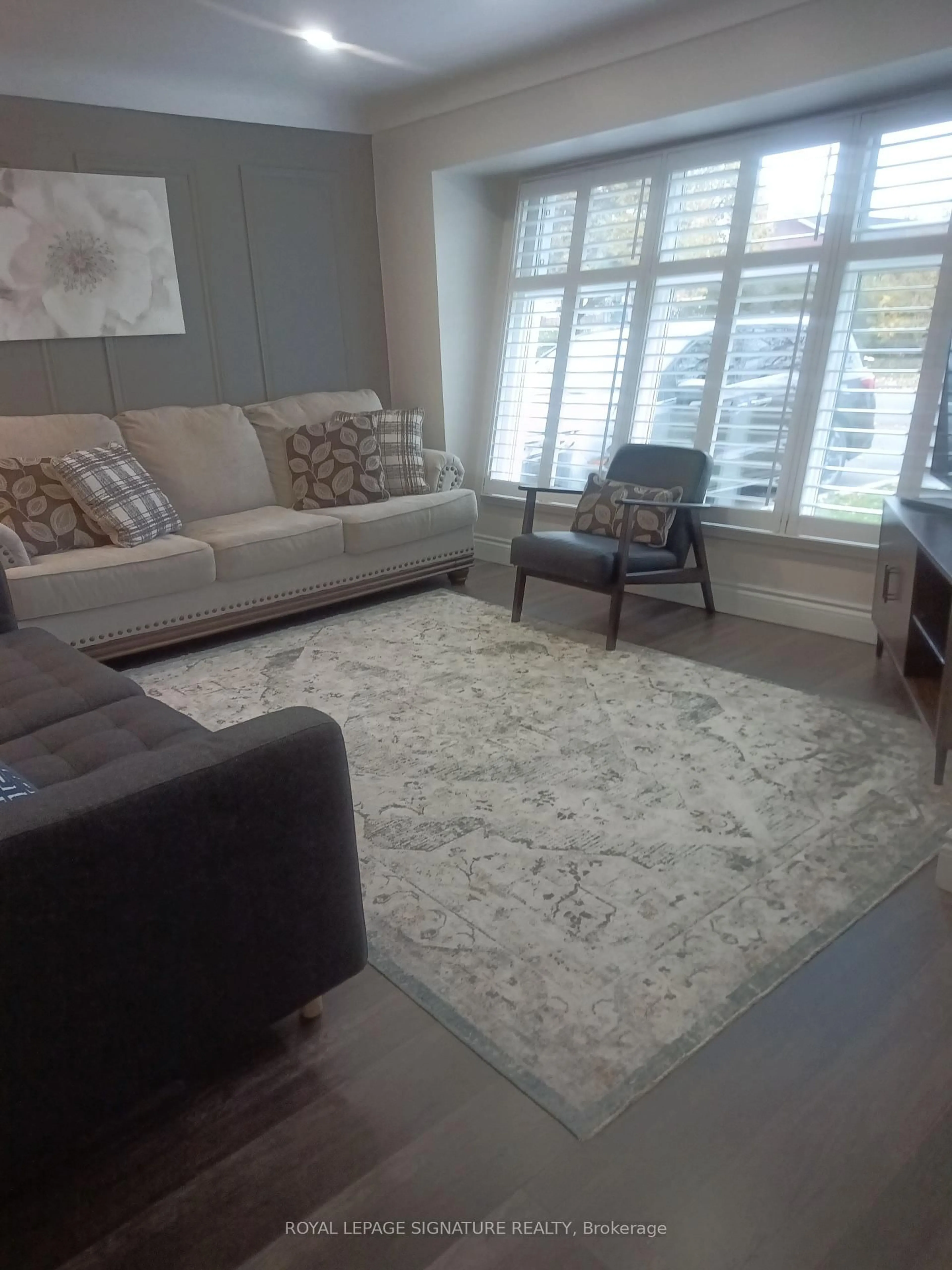 Living room with furniture, carpet floor for 98 Jacobson Ave, St. Catharines Ontario L2T 3A3