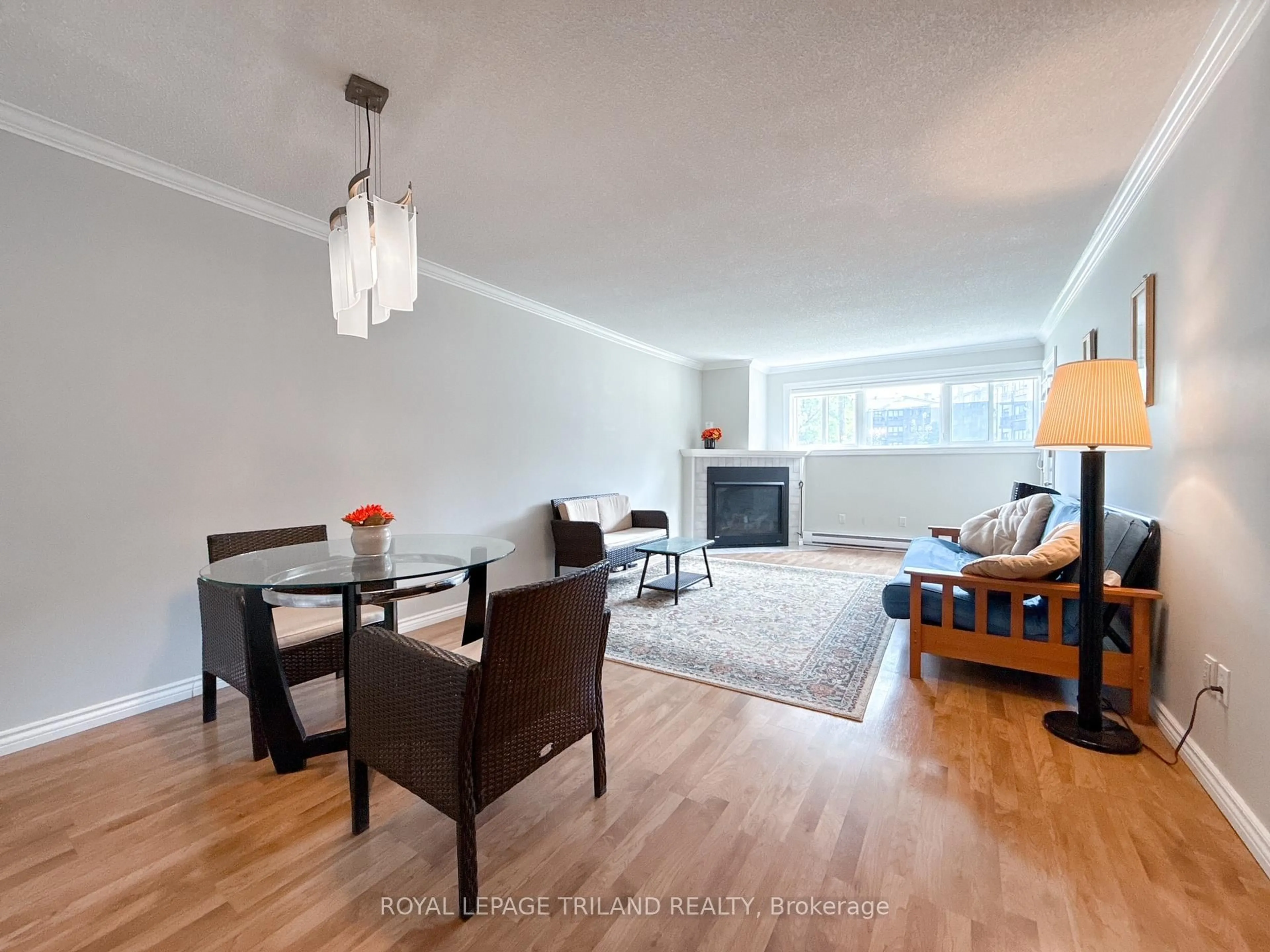 Living room with furniture, wood/laminate floor for 5 Jacksway Cres #110, London North Ontario N5X 3T6