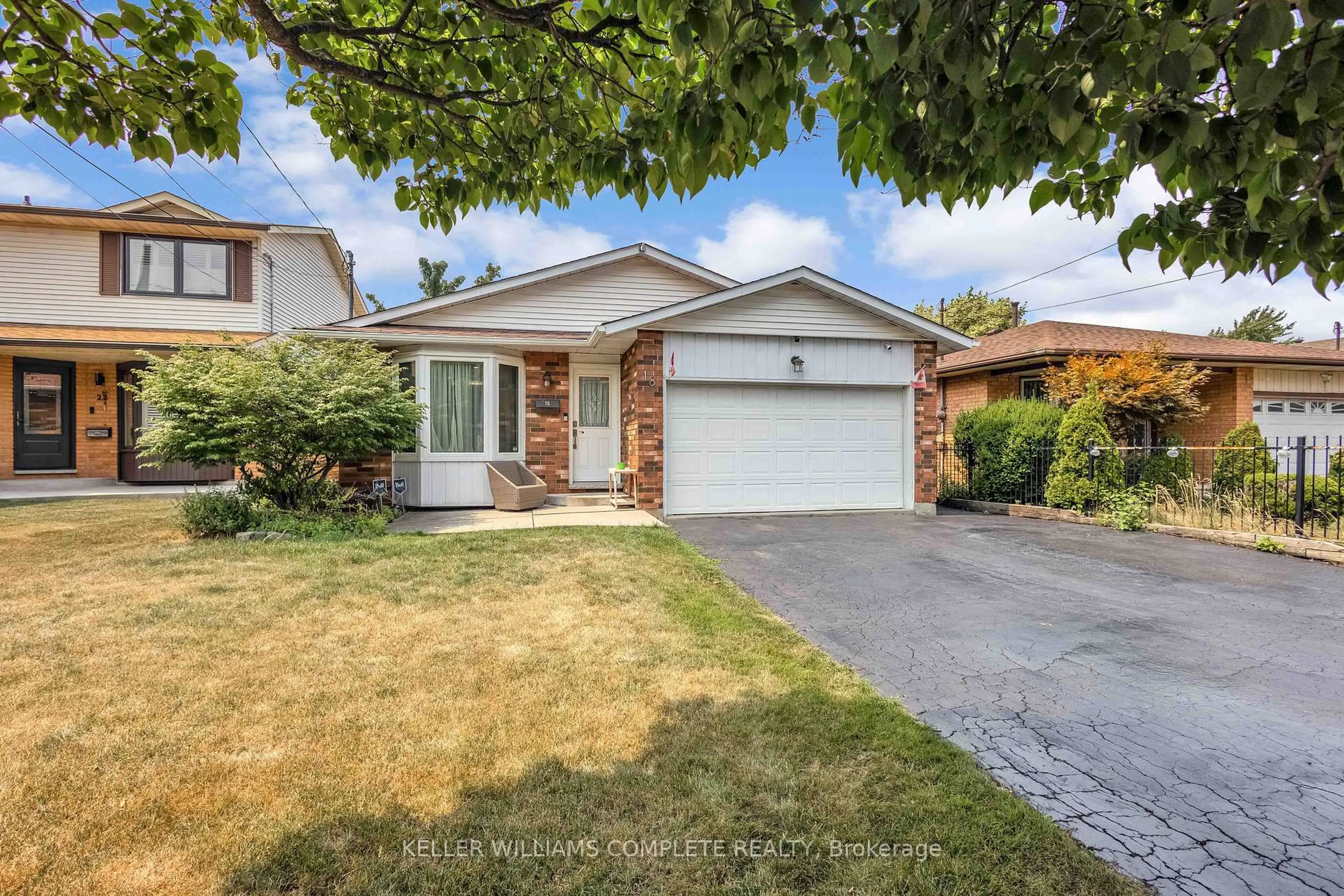 Home with brick exterior material, street for 18 Rosewell St, Hamilton Ontario L8W 2L1