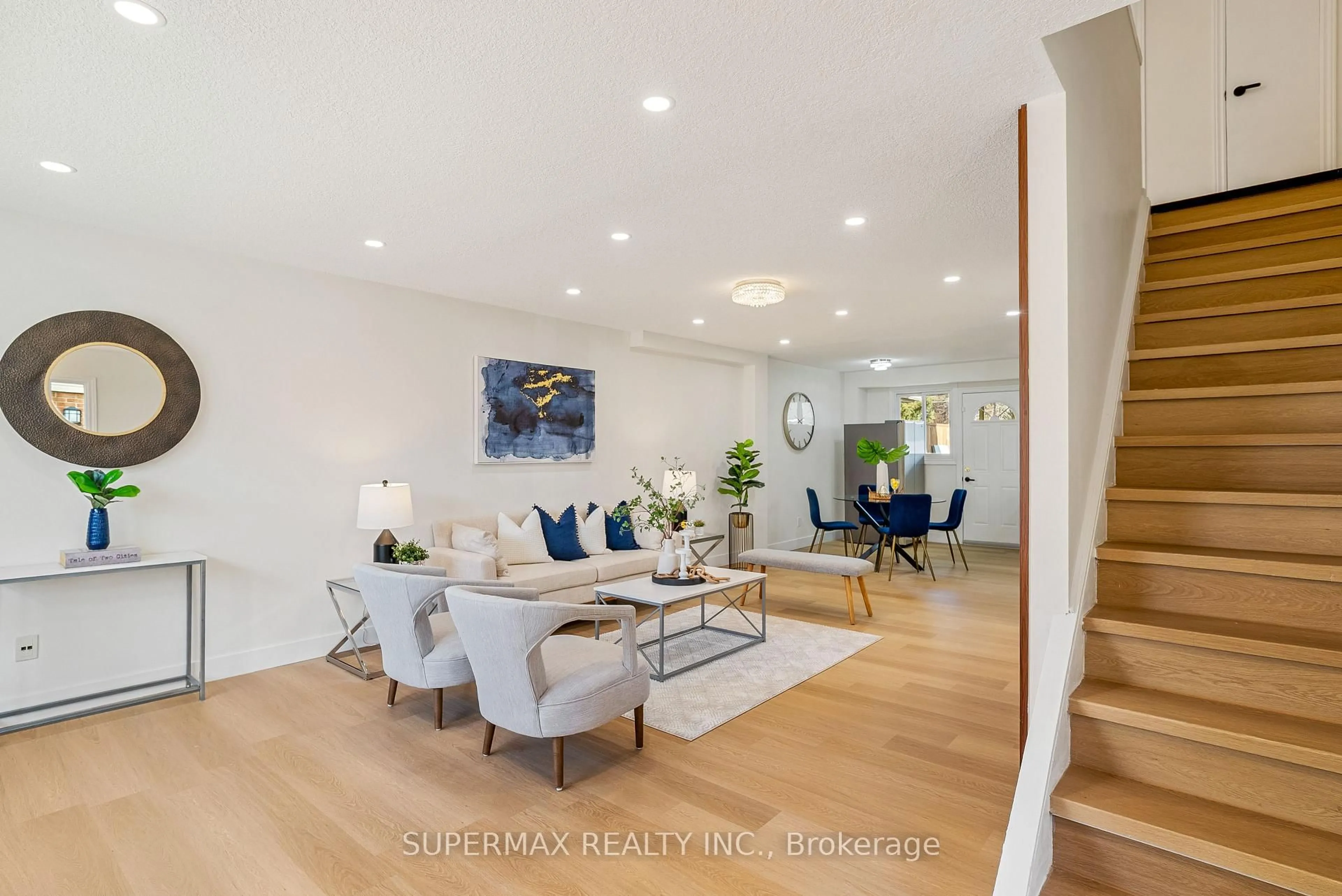Living room with furniture, wood/laminate floor for 92 Stroud Cres #66, London South Ontario N6E 1Y8