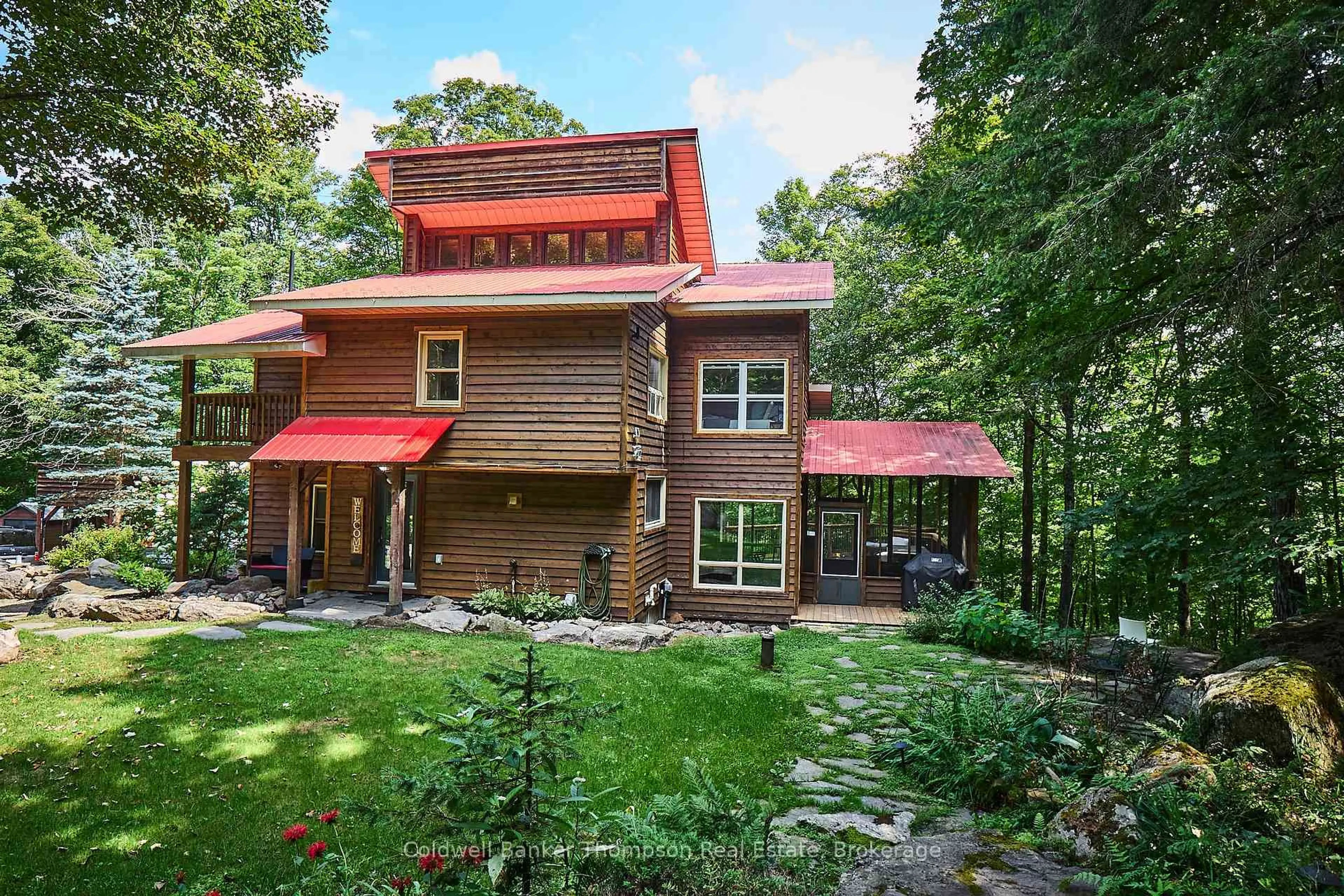 Home with brick exterior material, forest/trees view for 869 North Mary Lake Rd, Huntsville Ontario P1H 1S4