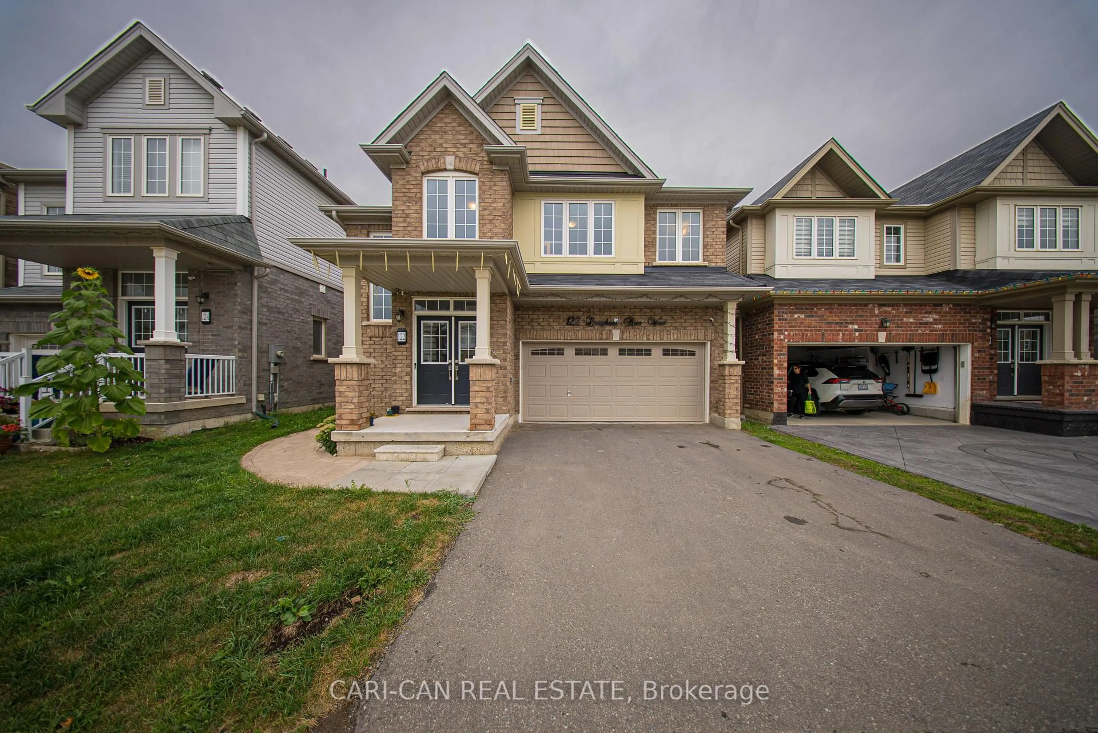 Home with brick exterior material, street for 122 Longboat Run West, Brantford Ontario N3T 0P3