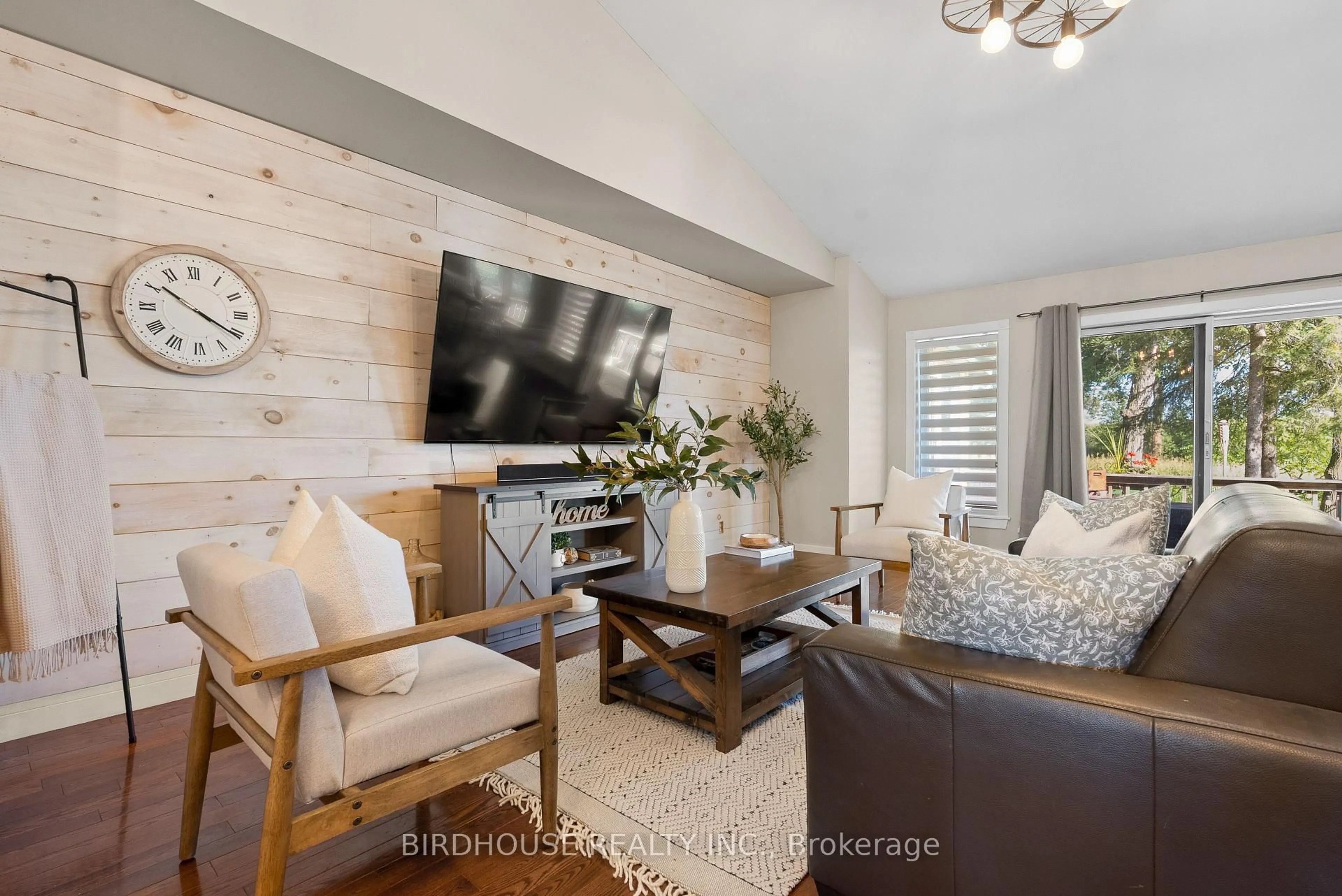 Living room with furniture, wood/laminate floor for 651 The Glen Rd, Kawartha Lakes Ontario K0M 2T0