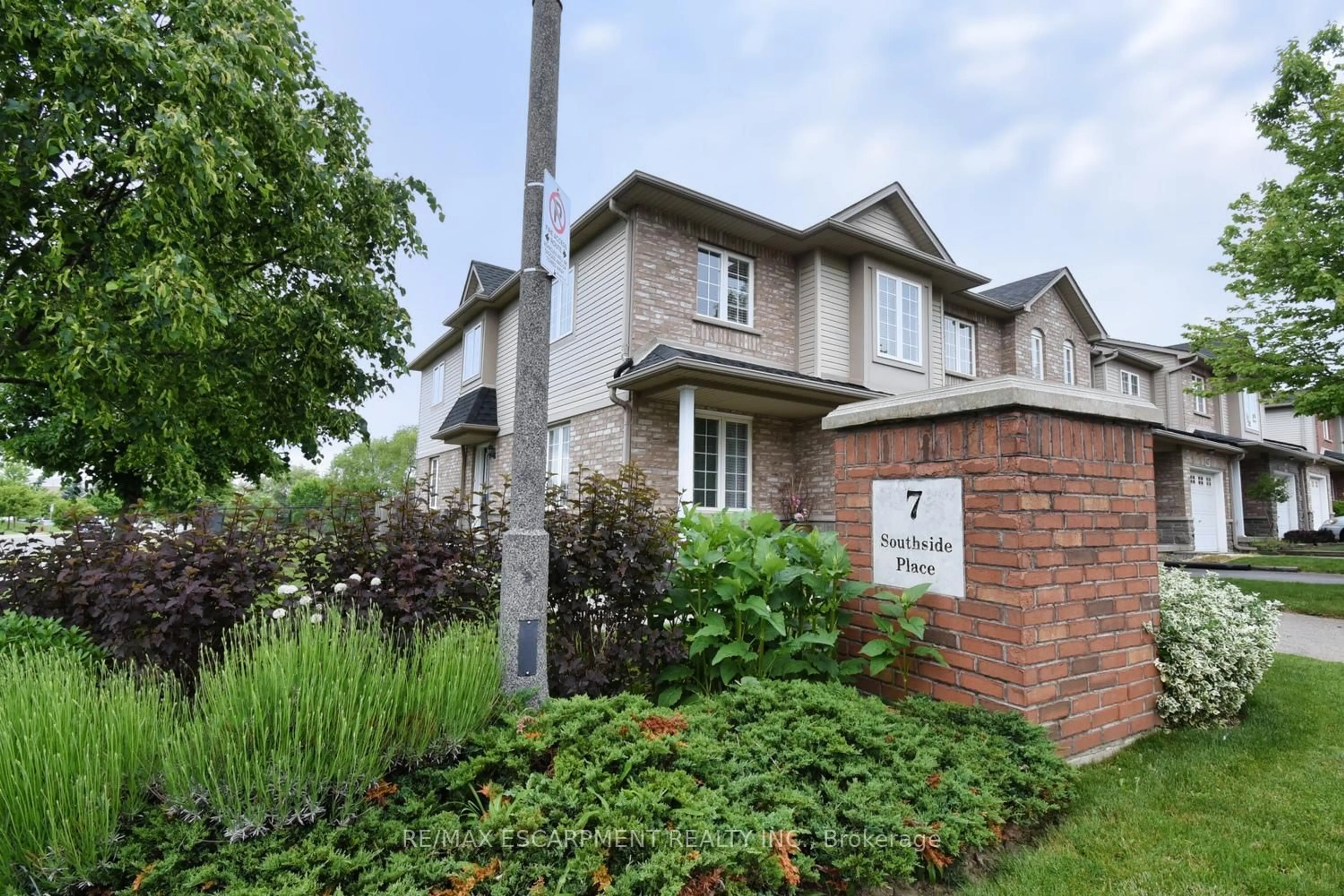 Home with brick exterior material, street for 7 Southside Pl #49, Hamilton Ontario L9C 7W6