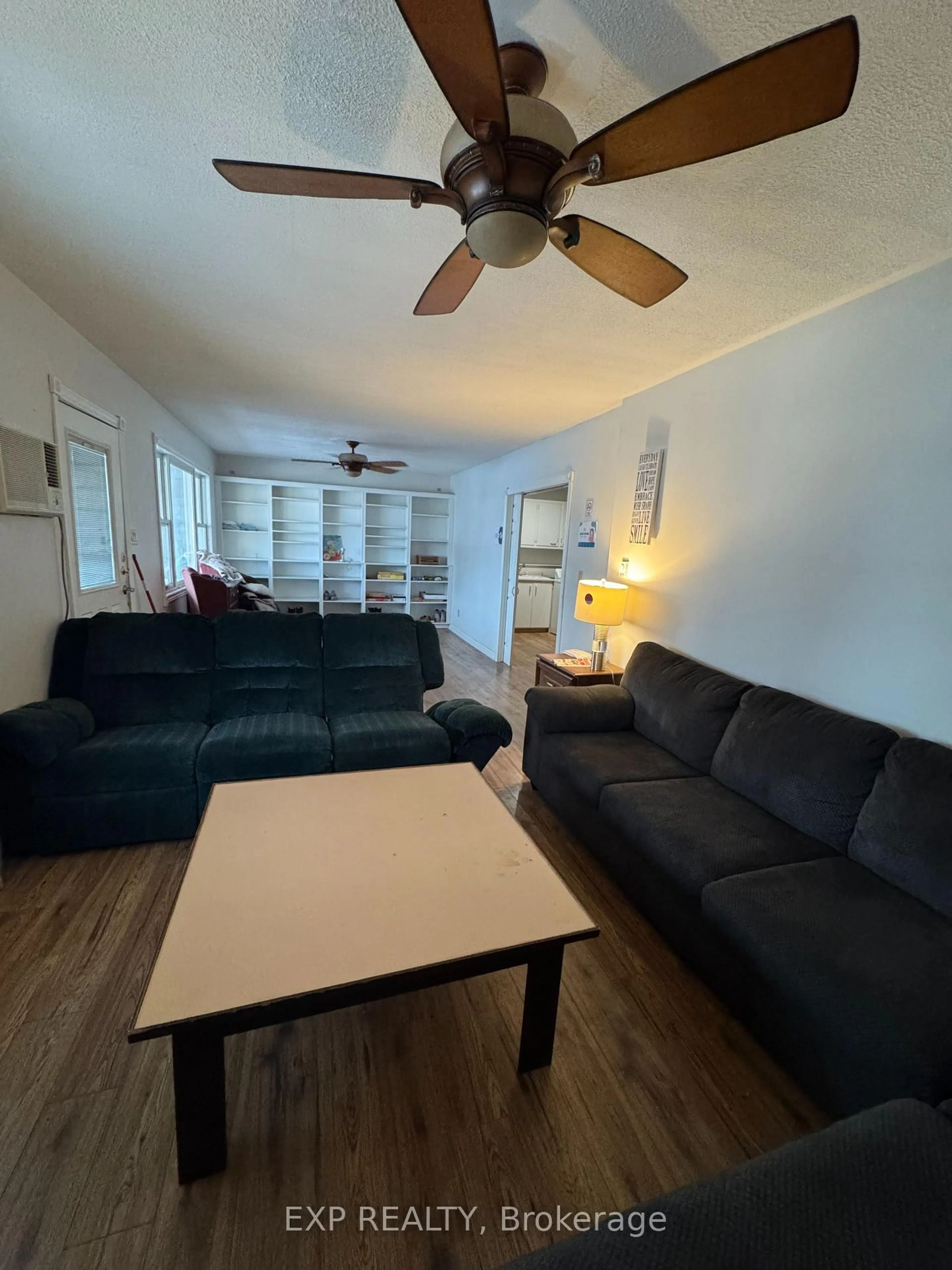 Living room with furniture, wood/laminate floor for 612 Romaine St, Peterborough Ontario K9J 2E4