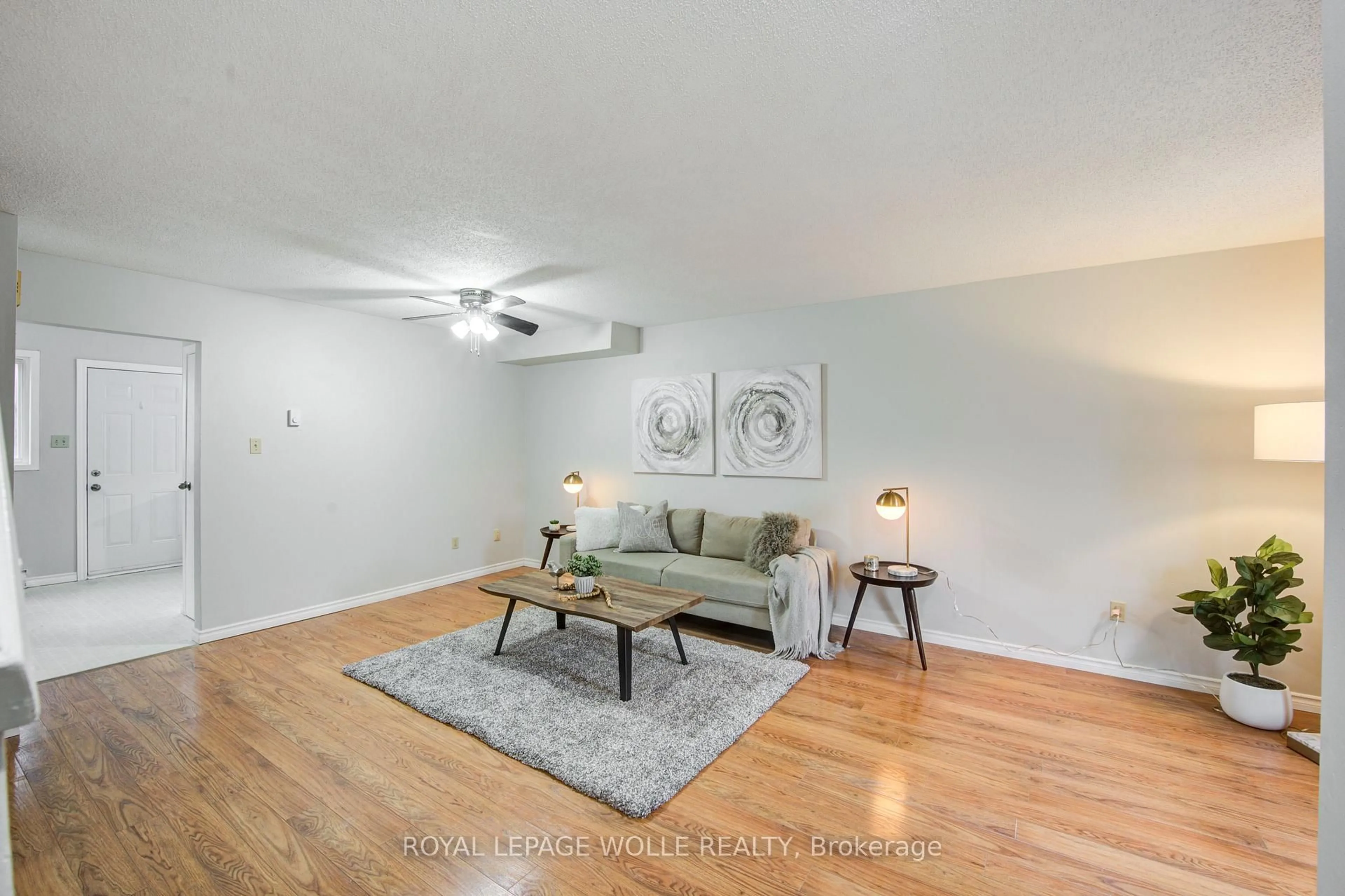 Living room with furniture, wood/laminate floor for 370 Springbank Ave #7, Woodstock Ontario N4T 1L3