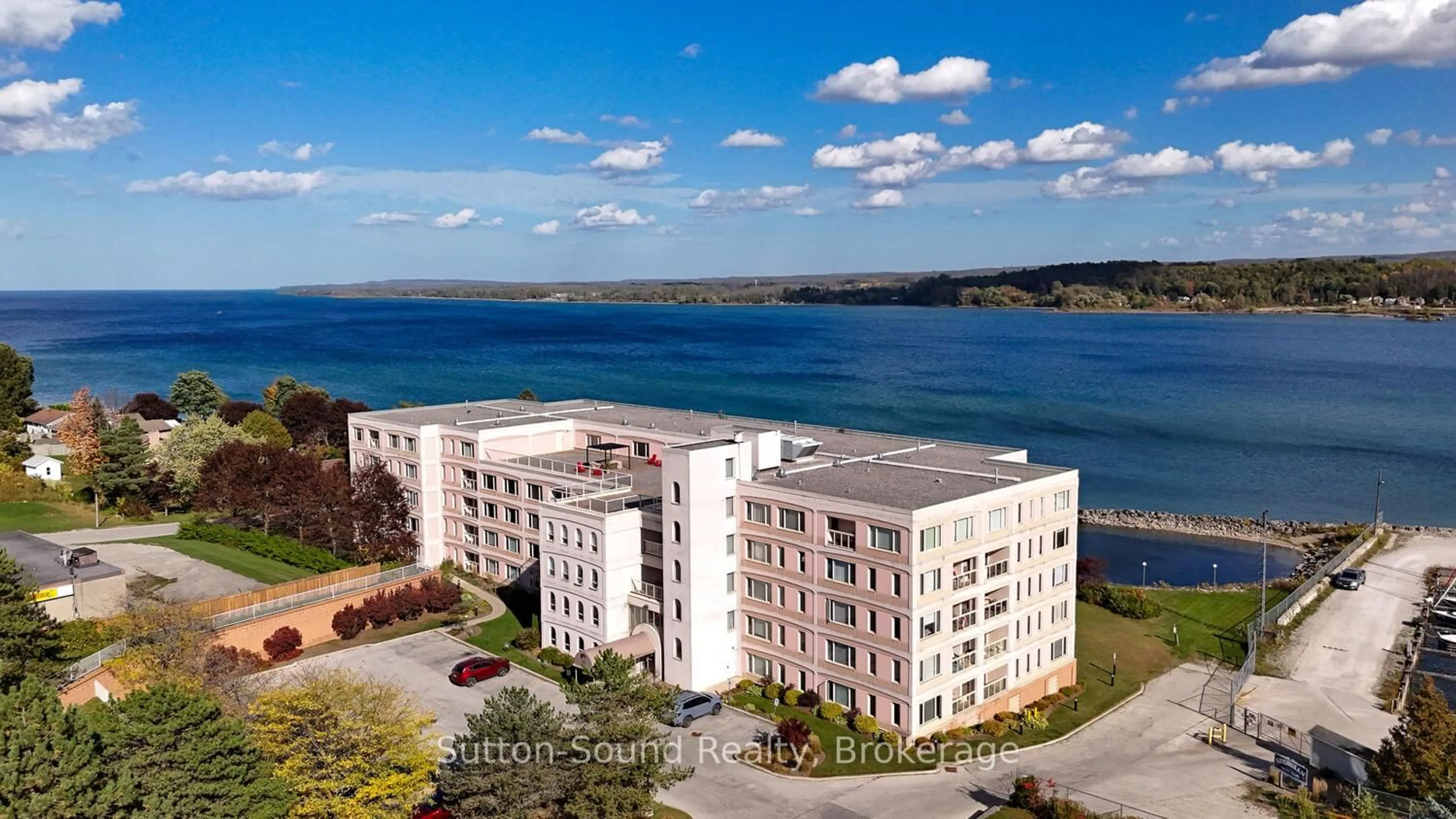 A pic from outside/outdoor area/front of a property/back of a property/a pic from drone, water/lake/river/ocean view for 2555 3rd Ave #315, Owen Sound Ontario N4K 6T8