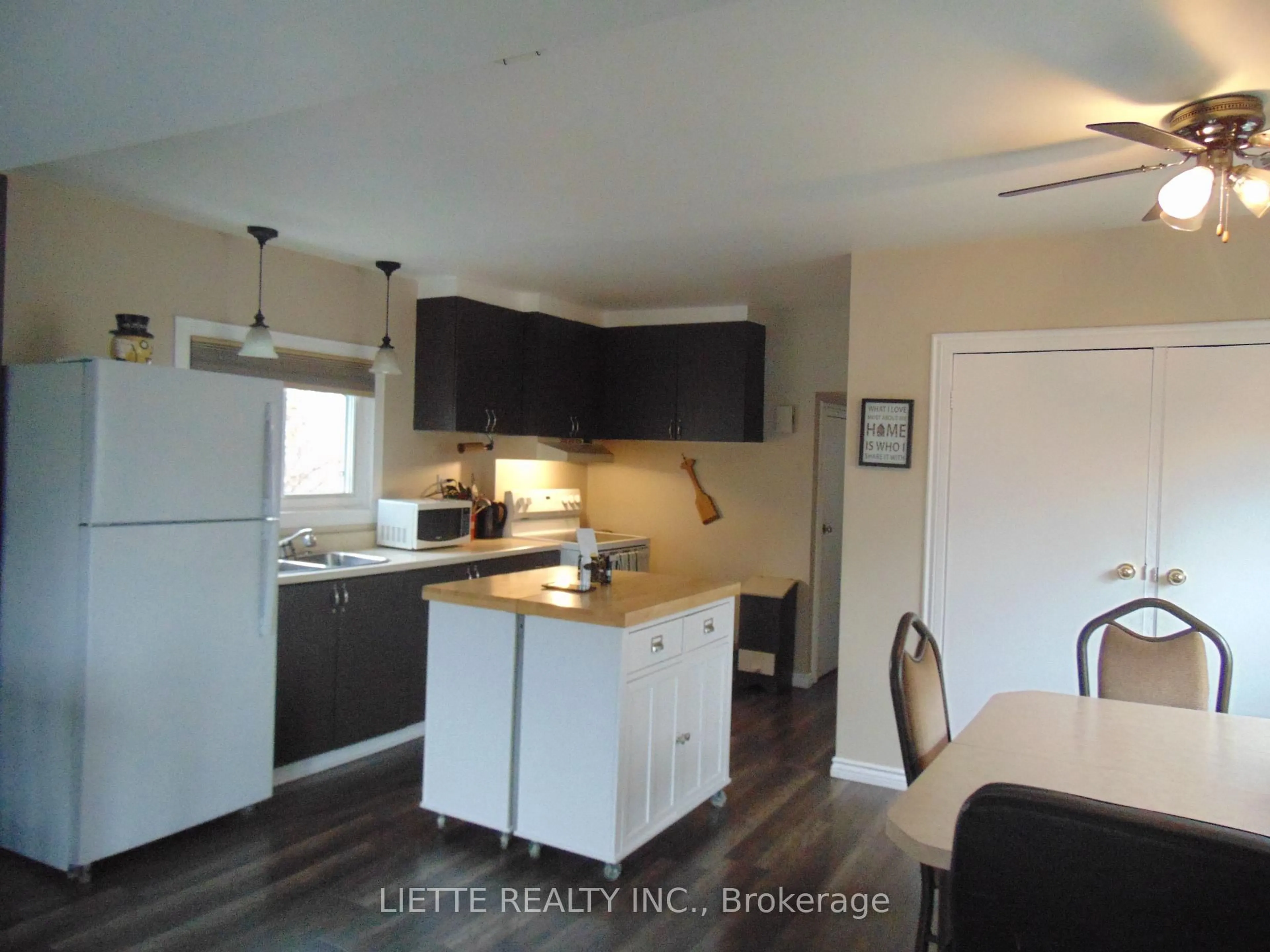 Open concept kitchen, wood/laminate floor for 317 8th St, Cornwall Ontario K6H 2S6