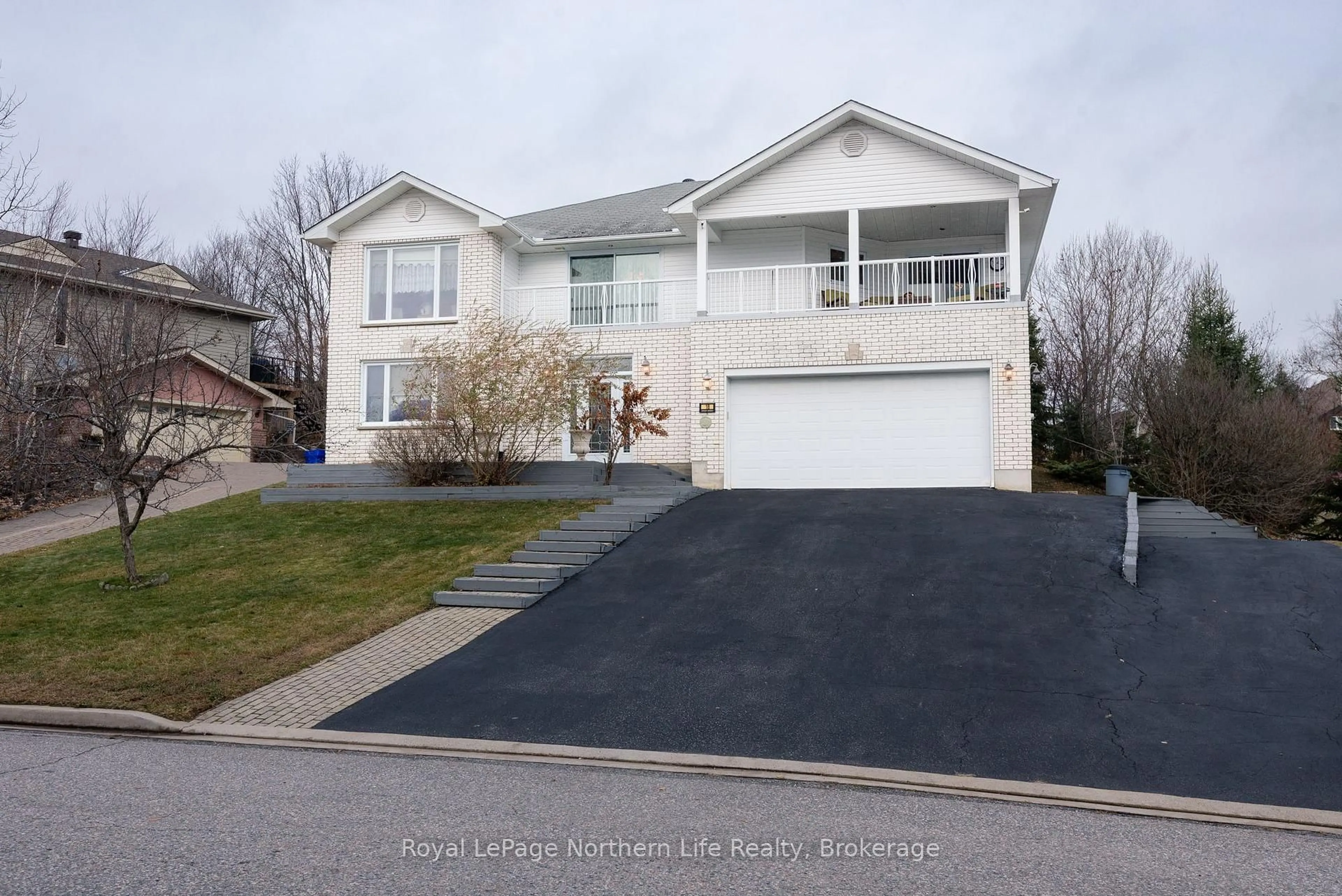 Home with vinyl exterior material, street for 18 Killare St, North Bay Ontario P1A 4J2