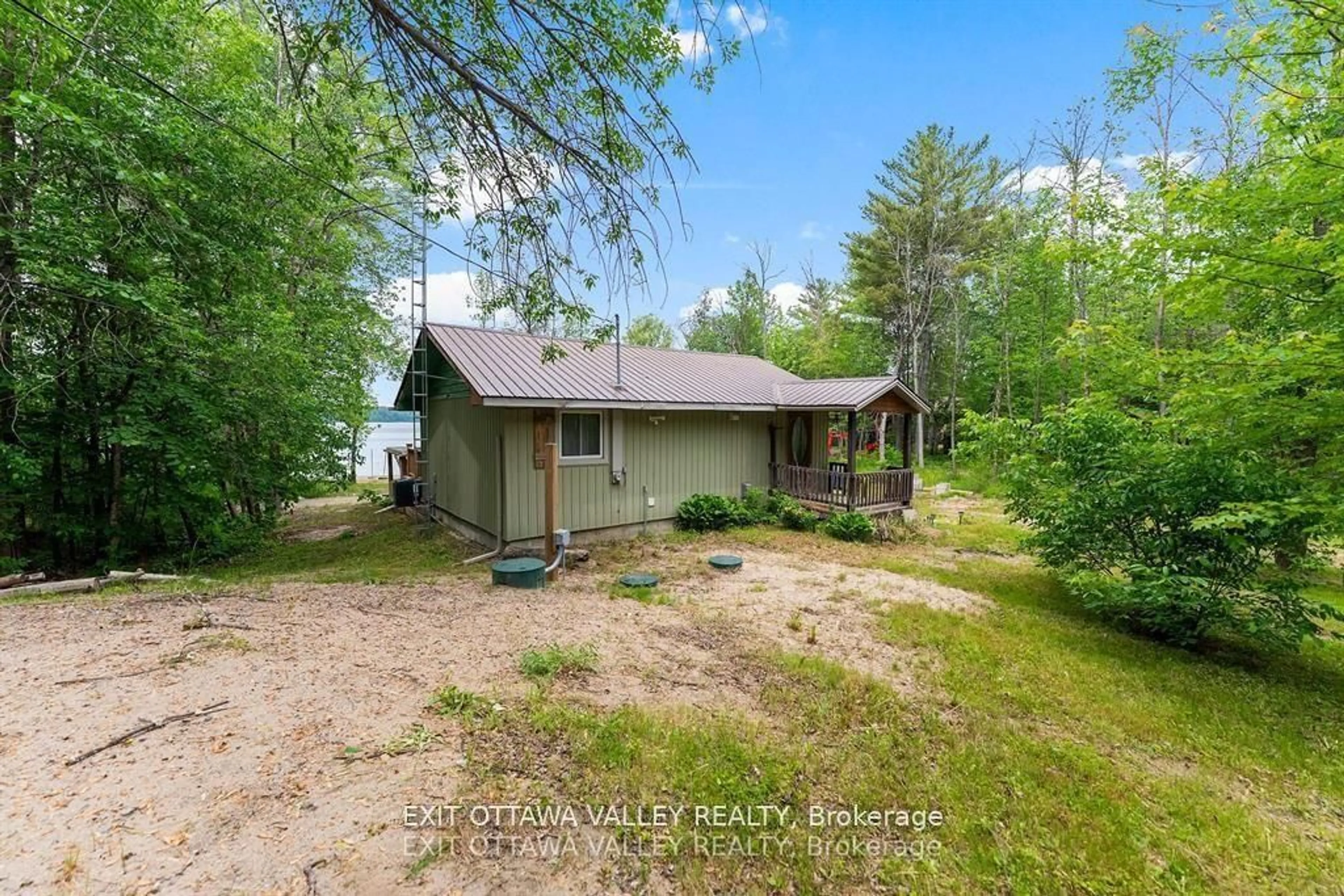 A pic from outside/outdoor area/front of a property/back of a property/a pic from drone, water/lake/river/ocean view for 303 Gervais Rd, Westmeath Ontario K0J 2L0