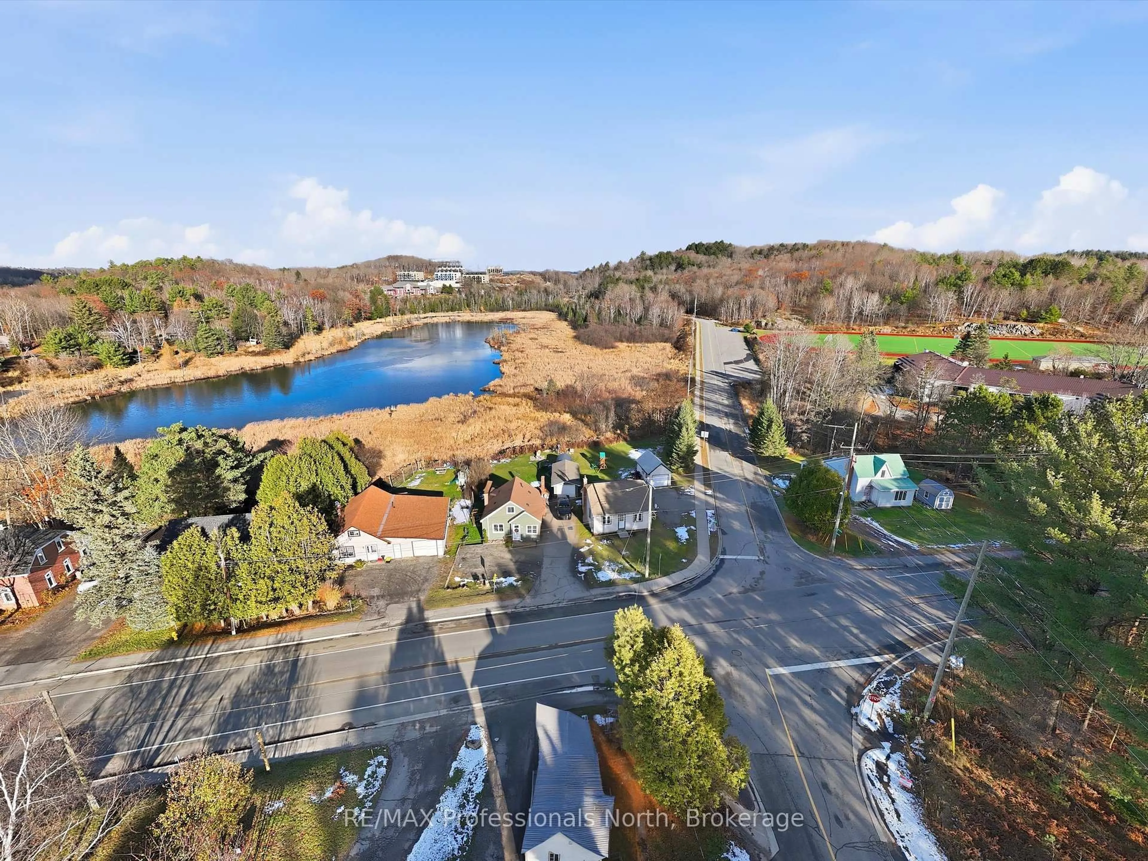 A pic from outside/outdoor area/front of a property/back of a property/a pic from drone, water/lake/river/ocean view for 107 Brunel Rd, Huntsville Ontario P1H 1R1