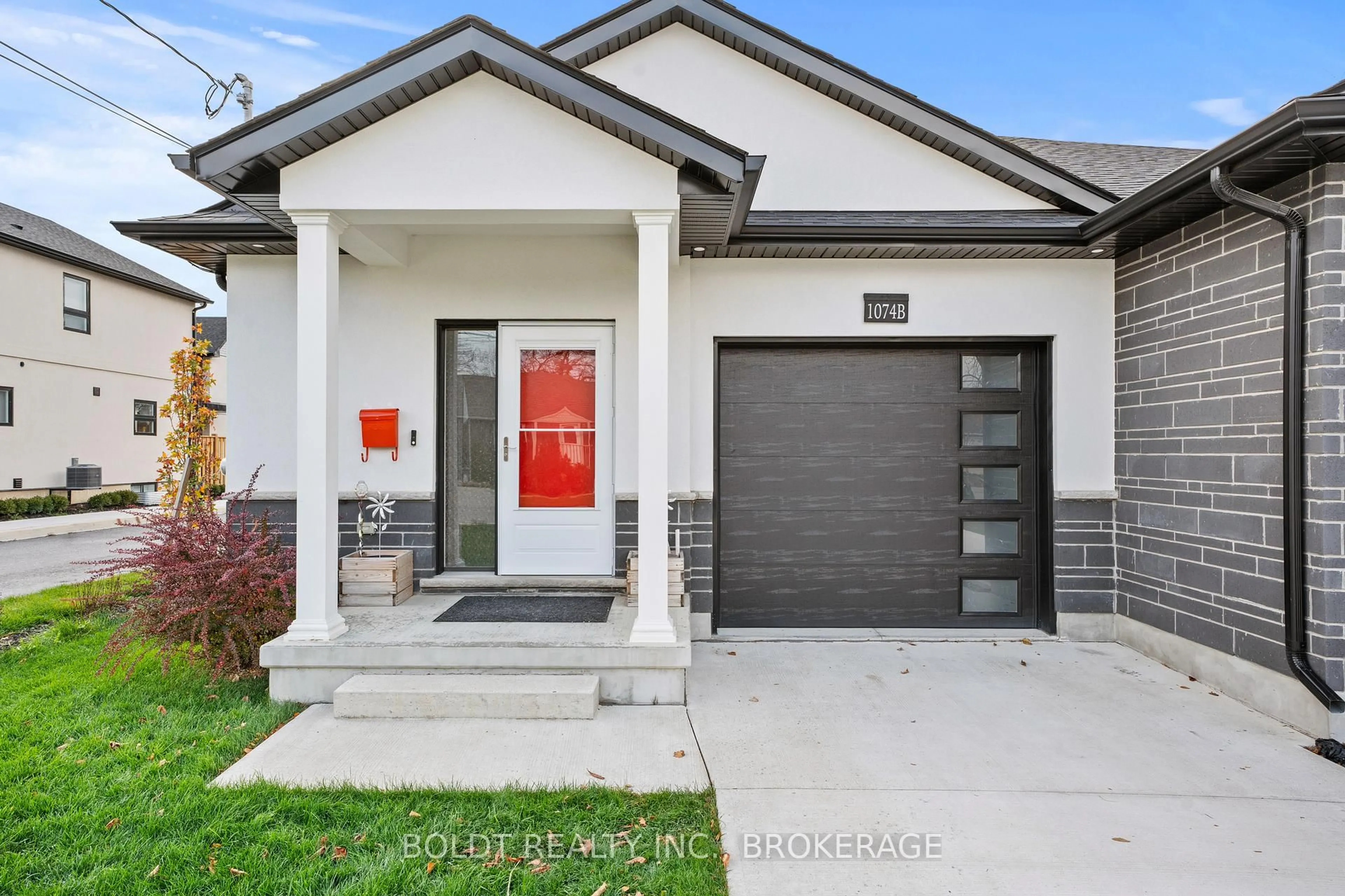 Home with brick exterior material, street for 1074B Vansickle Rd, St. Catharines Ontario L2S 2X3