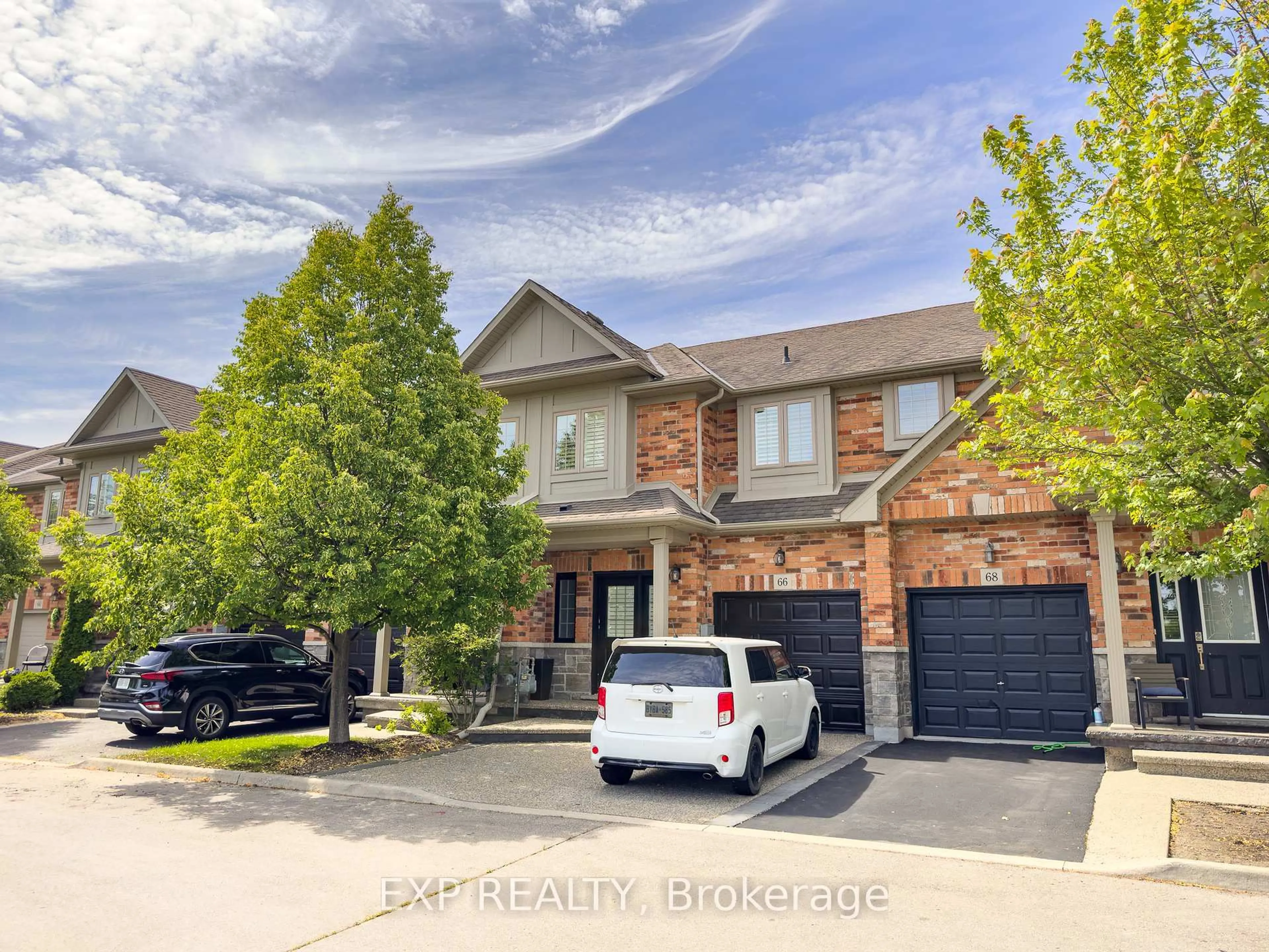 Home with brick exterior material, street for 66 Fall Fair Way, Hamilton Ontario L0R 1C0