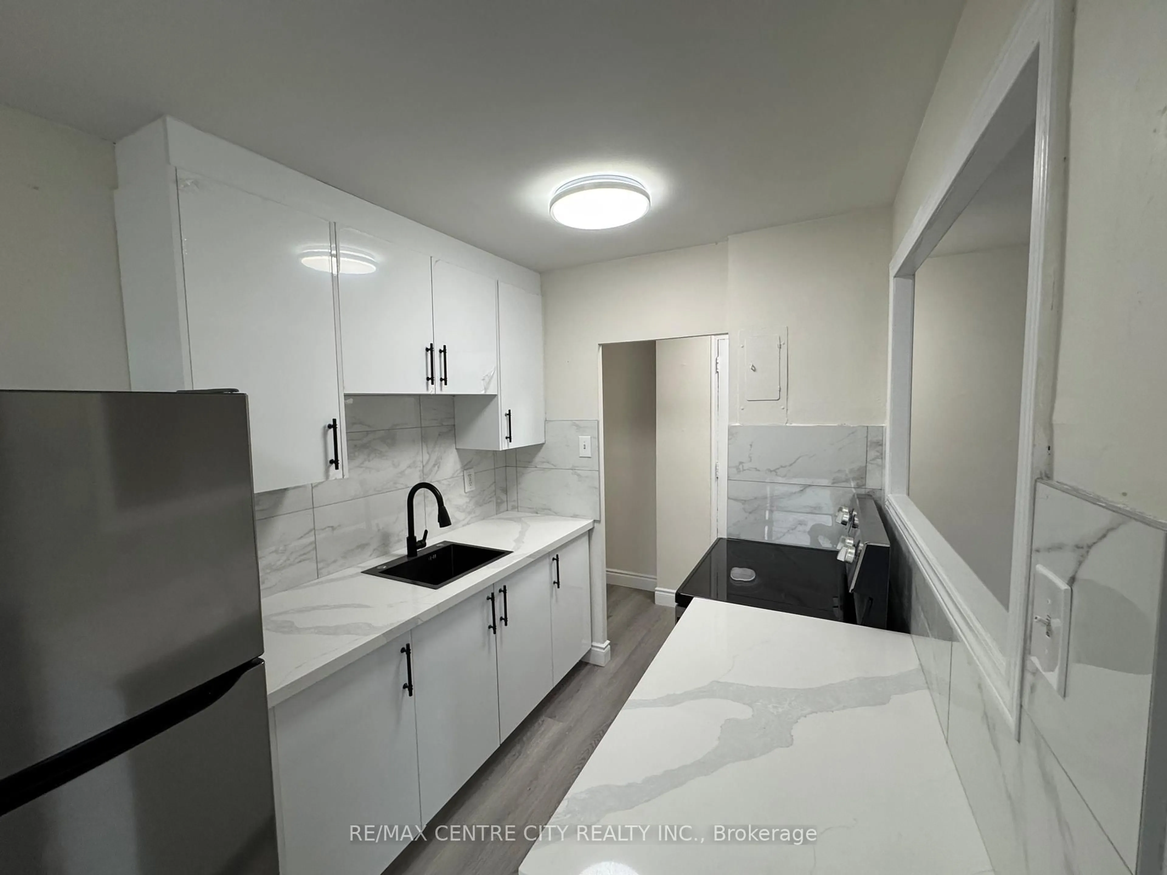 Standard kitchen, ceramic/tile floor for 1830 Dumont St #206, London East Ontario N5W 2S1