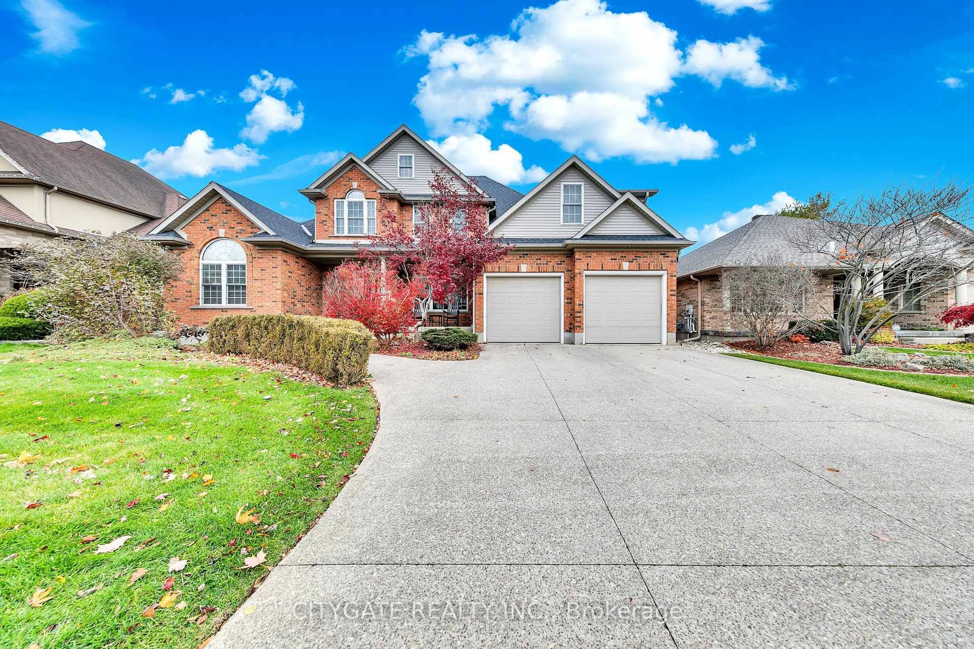 Home with brick exterior material, street for 552 Falconridge Cres, Waterloo Ontario N2K 4J2