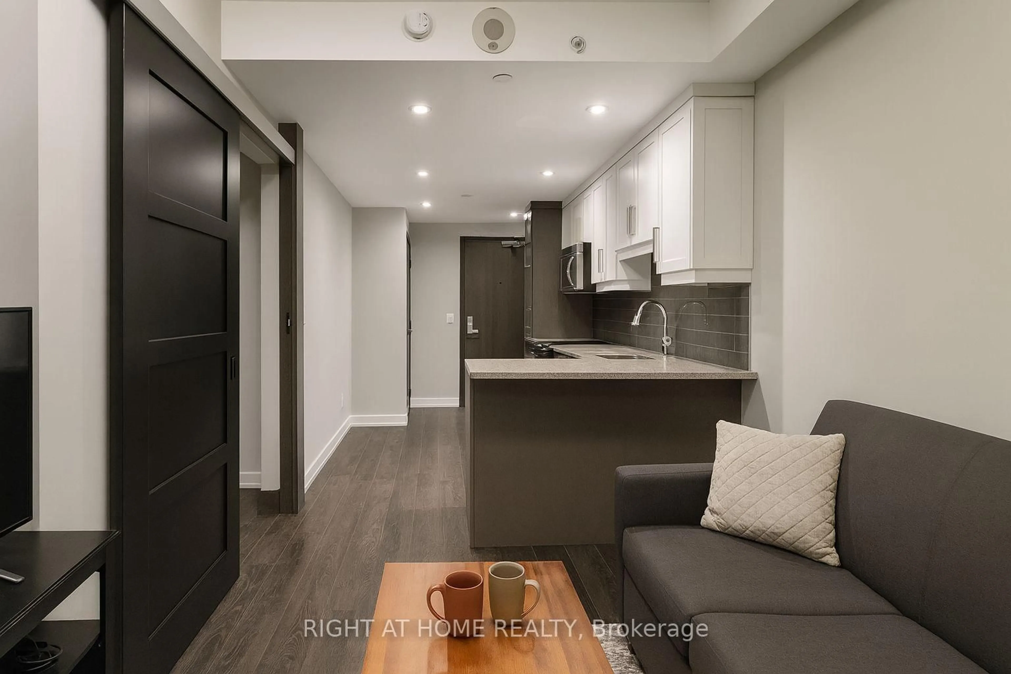 Open concept kitchen, wood/laminate floor for 330 Phillip St #N1803, Waterloo Ontario N2L 3W9