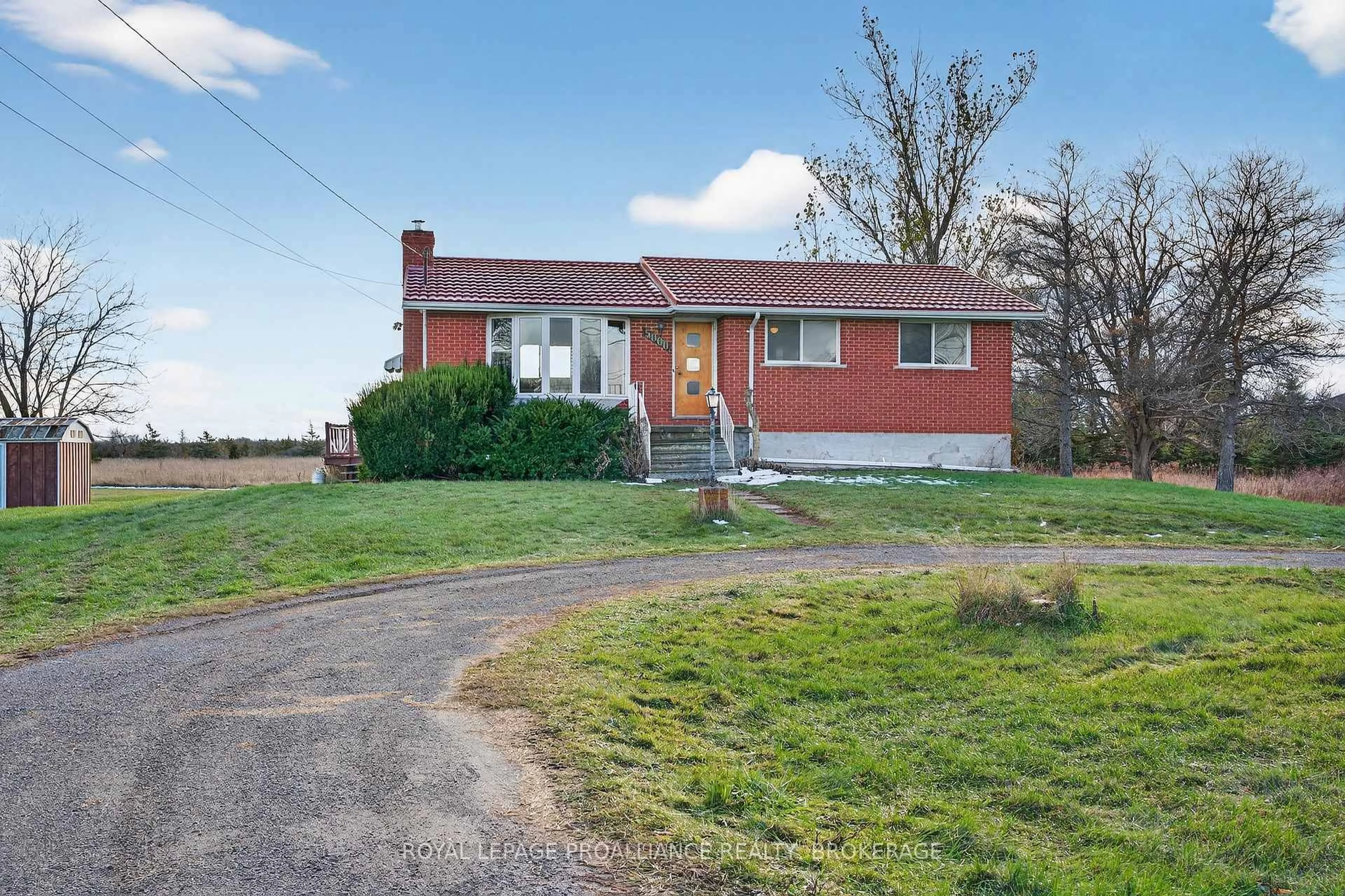 A pic from outside/outdoor area/front of a property/back of a property/a pic from drone, street for 5000 County Road 2, Bissett Creek Ontario K0H 2H0