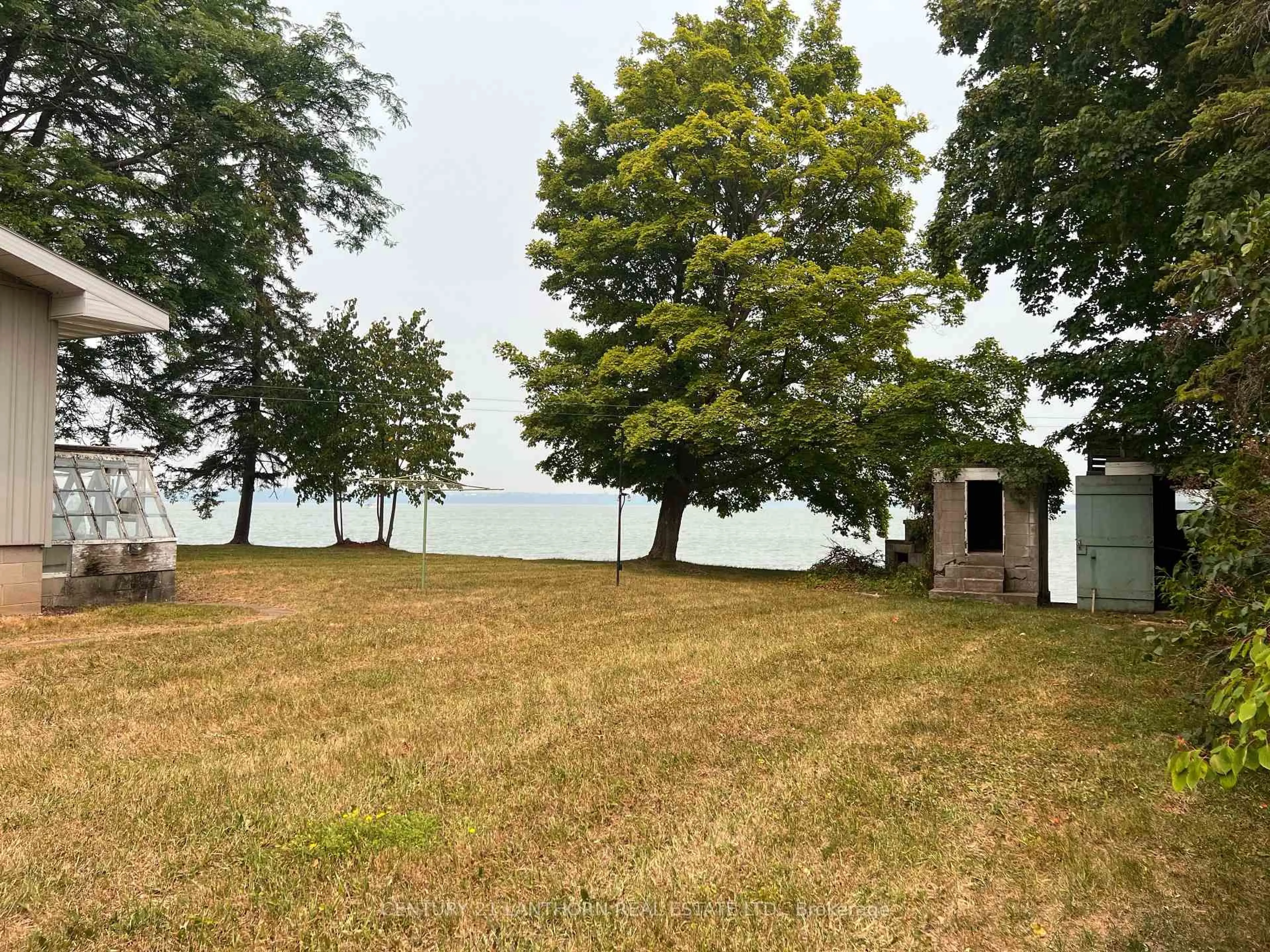 A pic from outside/outdoor area/front of a property/back of a property/a pic from drone, water/lake/river/ocean view for 11468 Loyalist Pkwy, Prince Edward County Ontario K0K 2T0