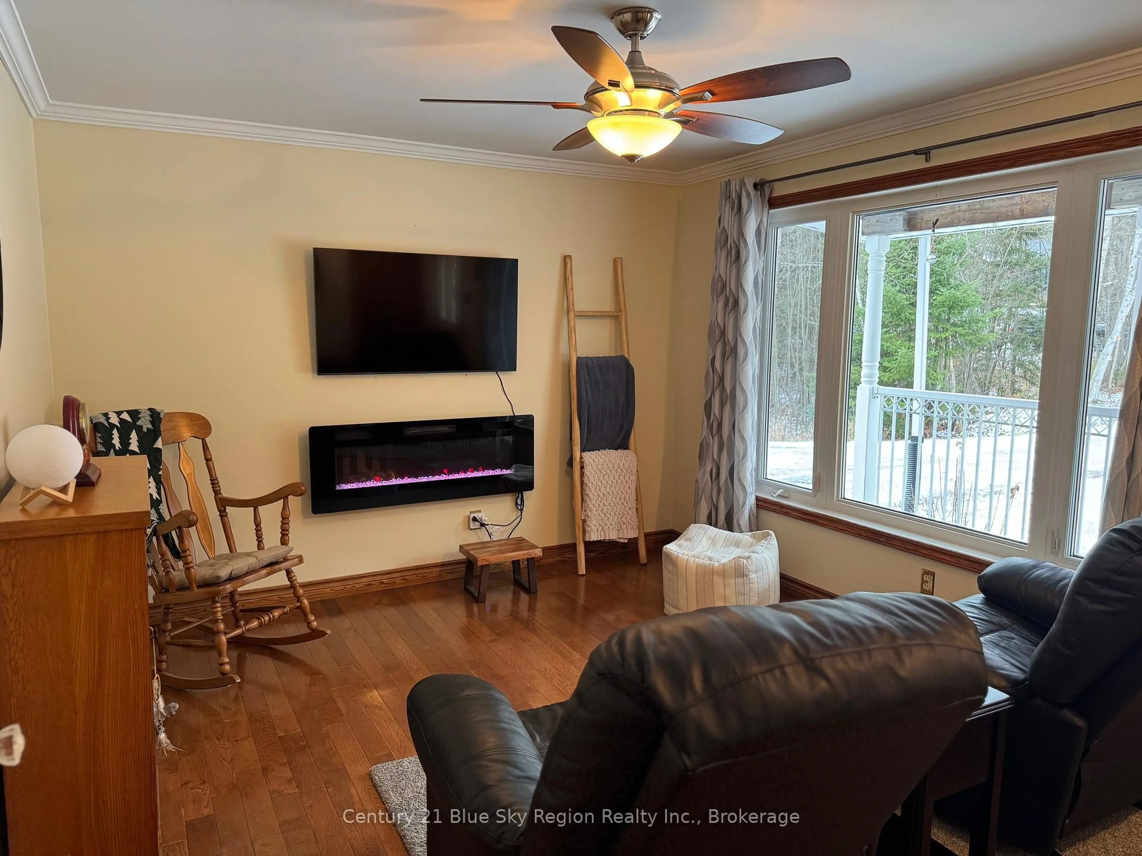 Living room with furniture, wood/laminate floor for 9 Treadlightly Dr, East Ferris Ontario P0H 1K0