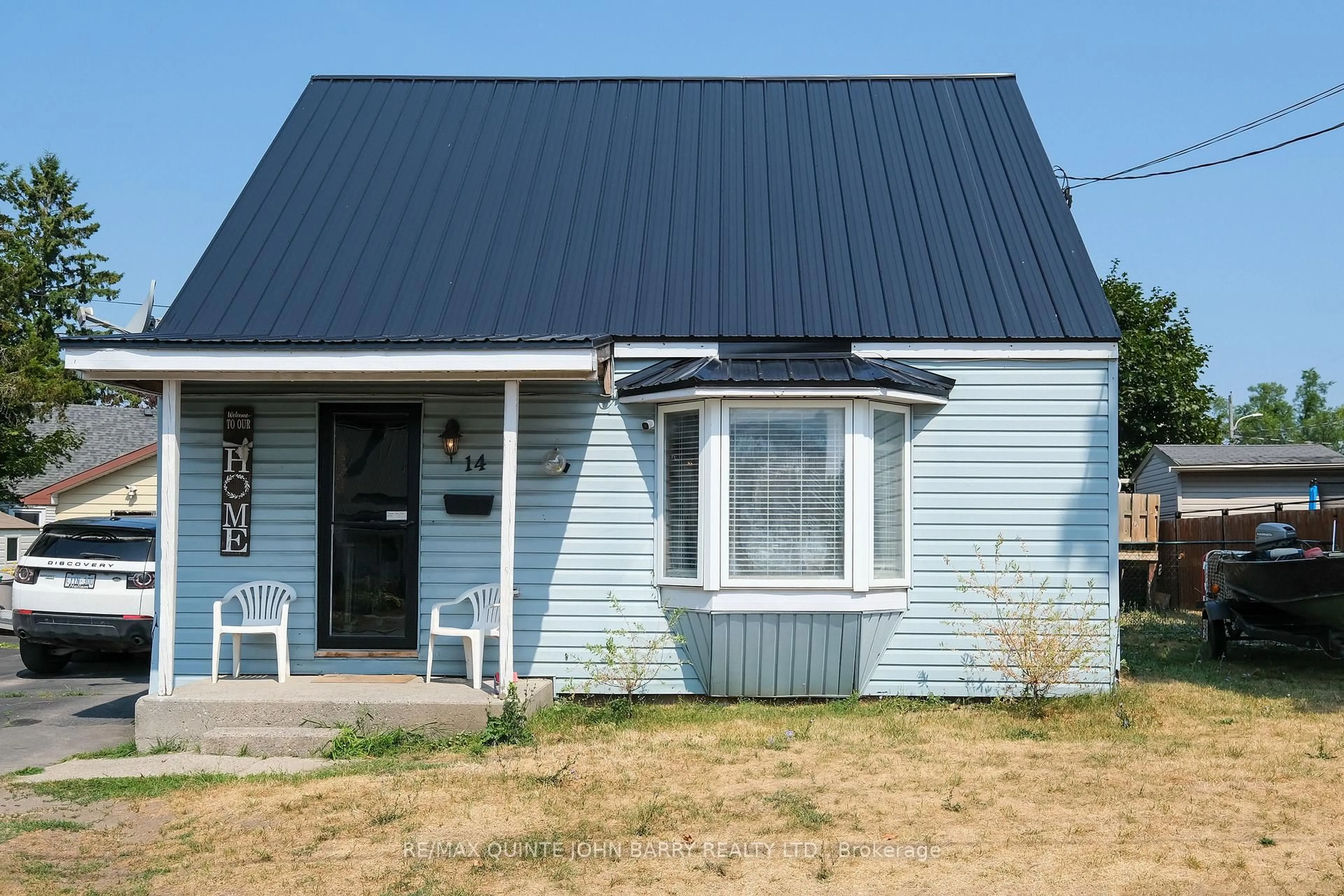 Home with vinyl exterior material, street for 14 Harriet St, Quinte West Ontario K8V 4L4