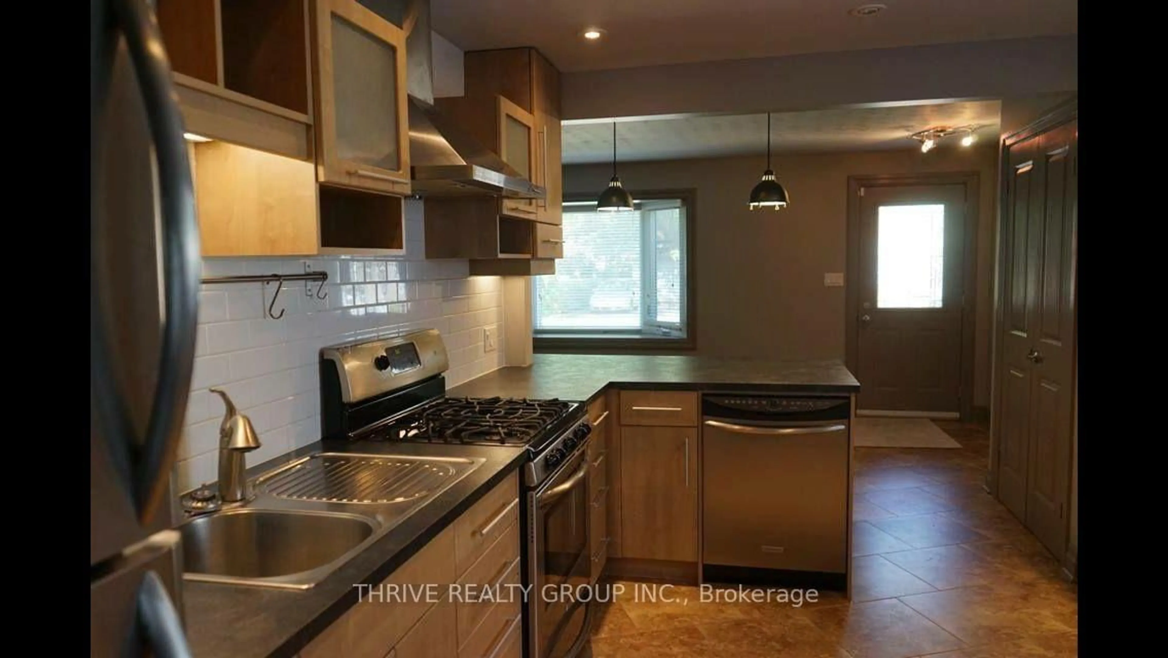 Open concept kitchen, wood/laminate floor for 12 Edith St, London North Ontario N6H 2E8
