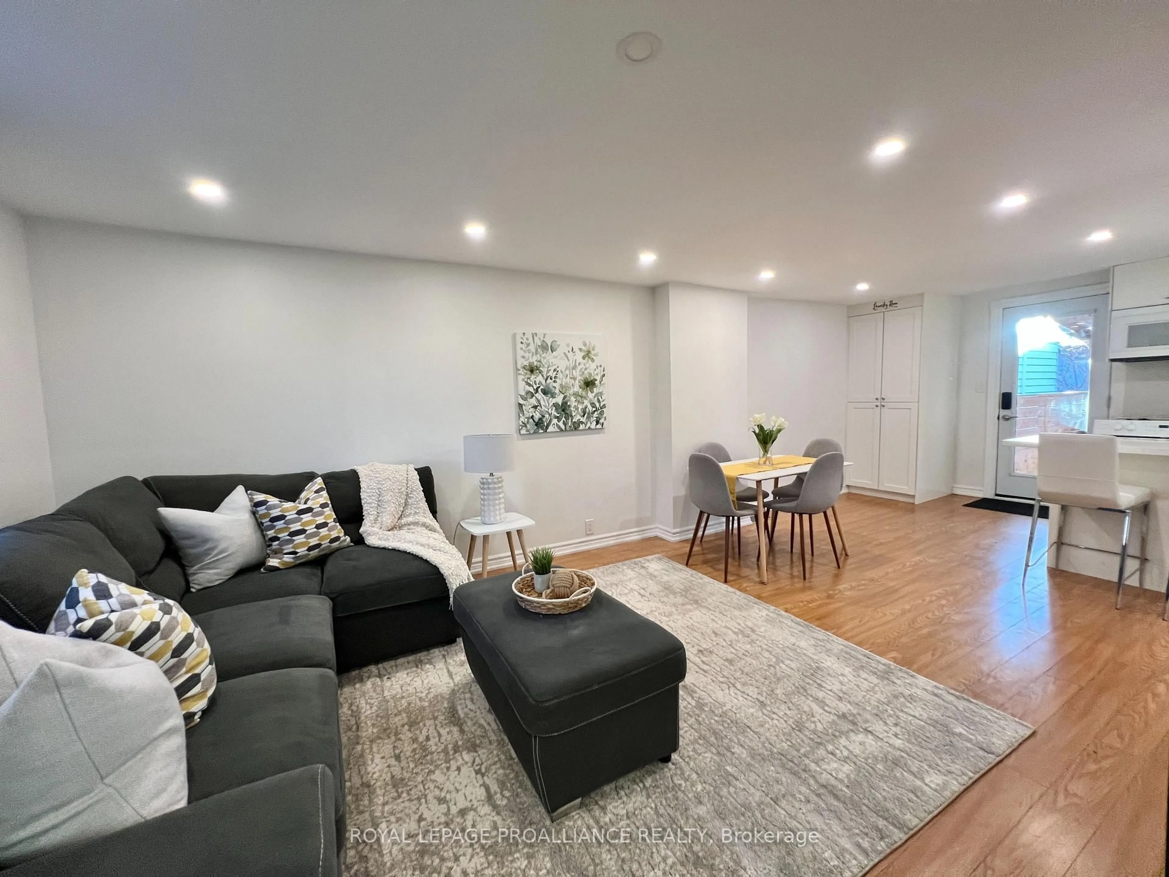 Living room with furniture, wood/laminate floor for 248 Dufferin Ave, Quinte West Ontario K8V 5E9