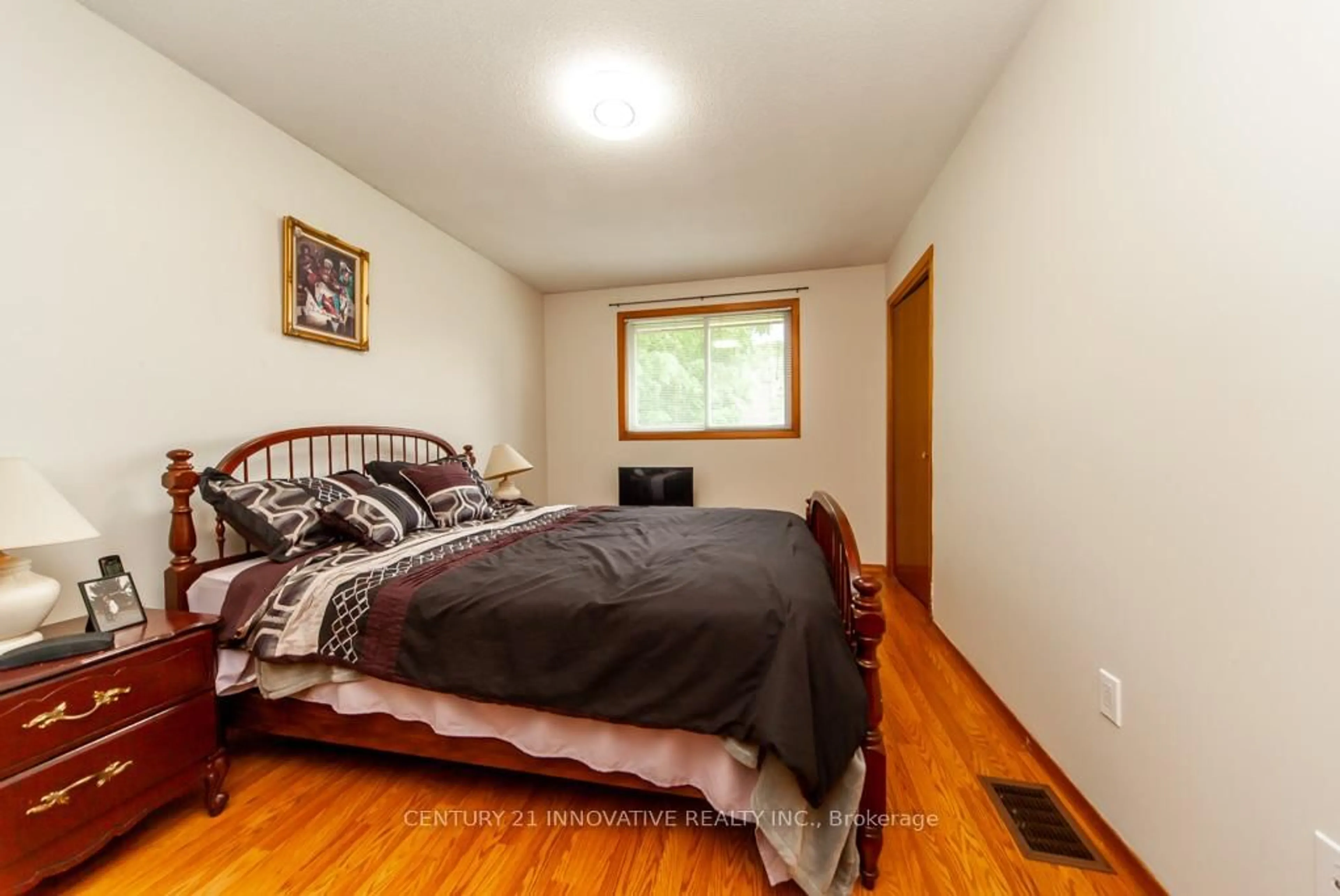 Bedroom with bed, wood/laminate floor for 501 Barnes Cres, Peterborough Ontario K9J 7Z2