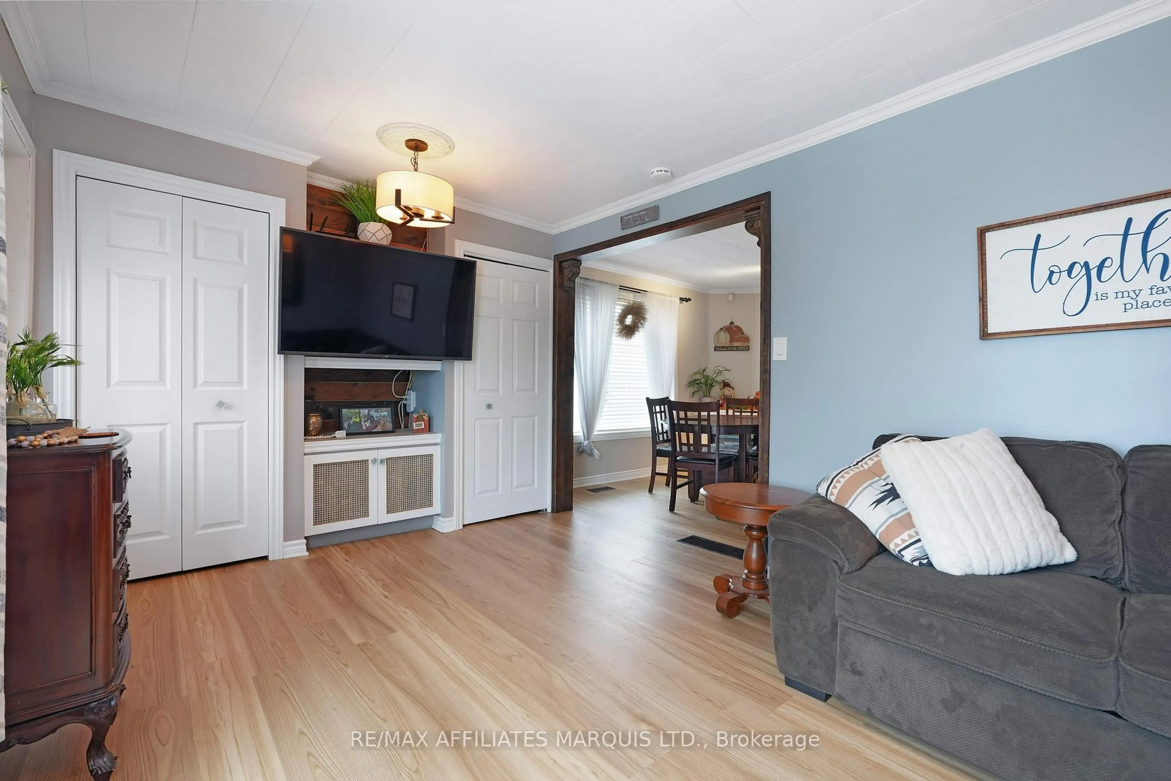 Living room with furniture, wood/laminate floor for 1617 OLD McConnell Ave, Cornwall Ontario K6H 7G8