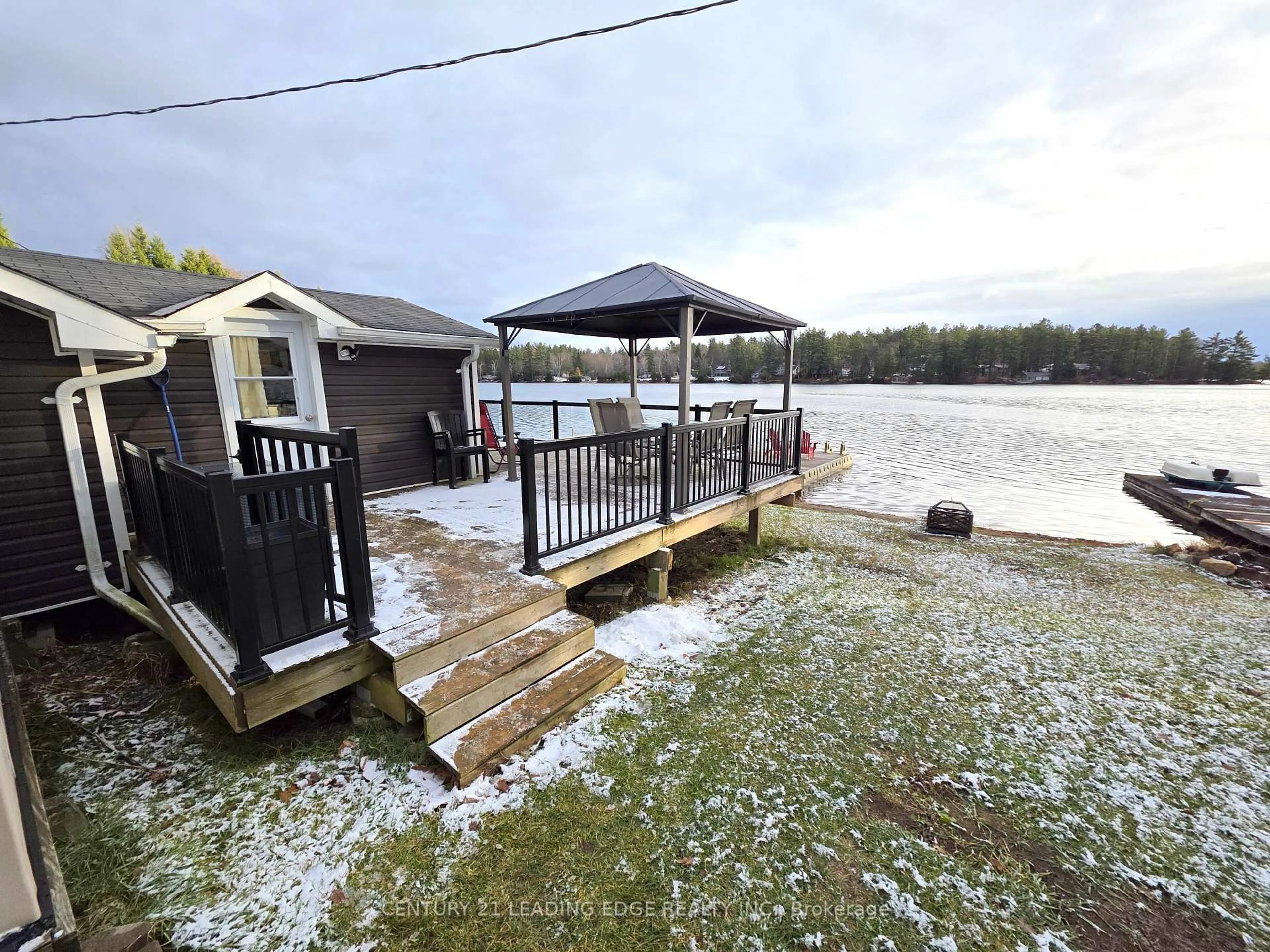 A pic from outside/outdoor area/front of a property/back of a property/a pic from drone, water/lake/river/ocean view for 1043 Lobo Dr #24, Minden Hills Ontario K0M 2K0