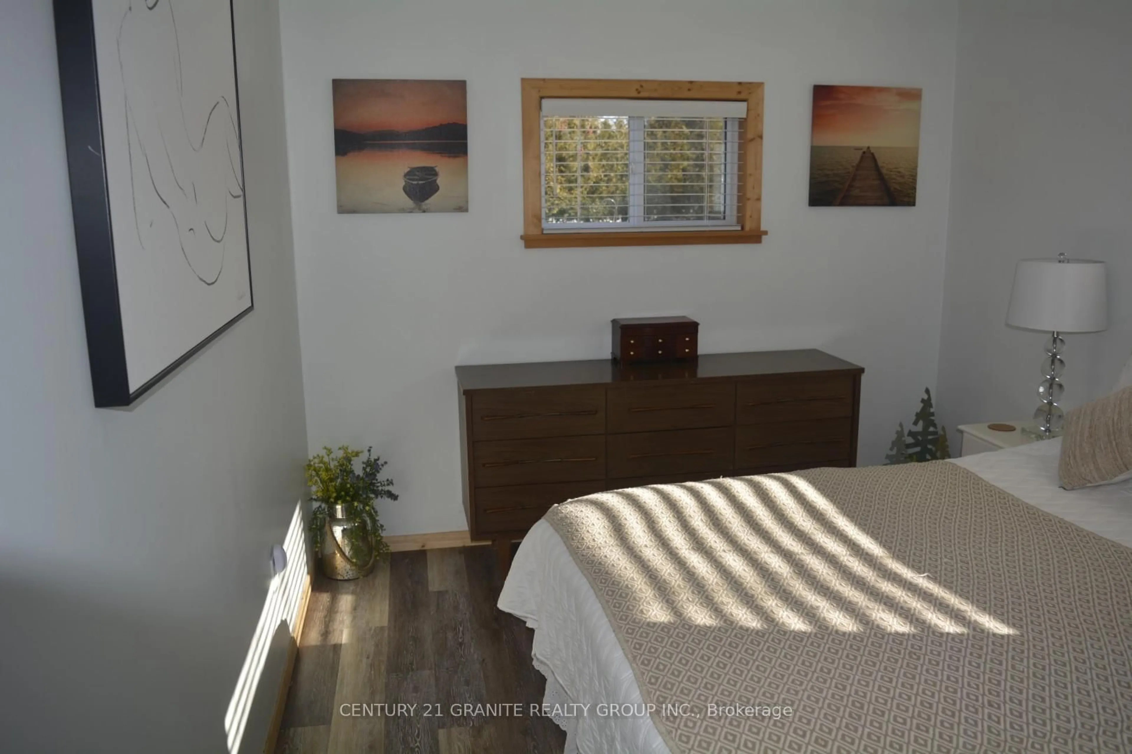 Bedroom with bed, wood/laminate floor for 114 Paudash Lake Rd, Bancroft Ontario K0L 1C0