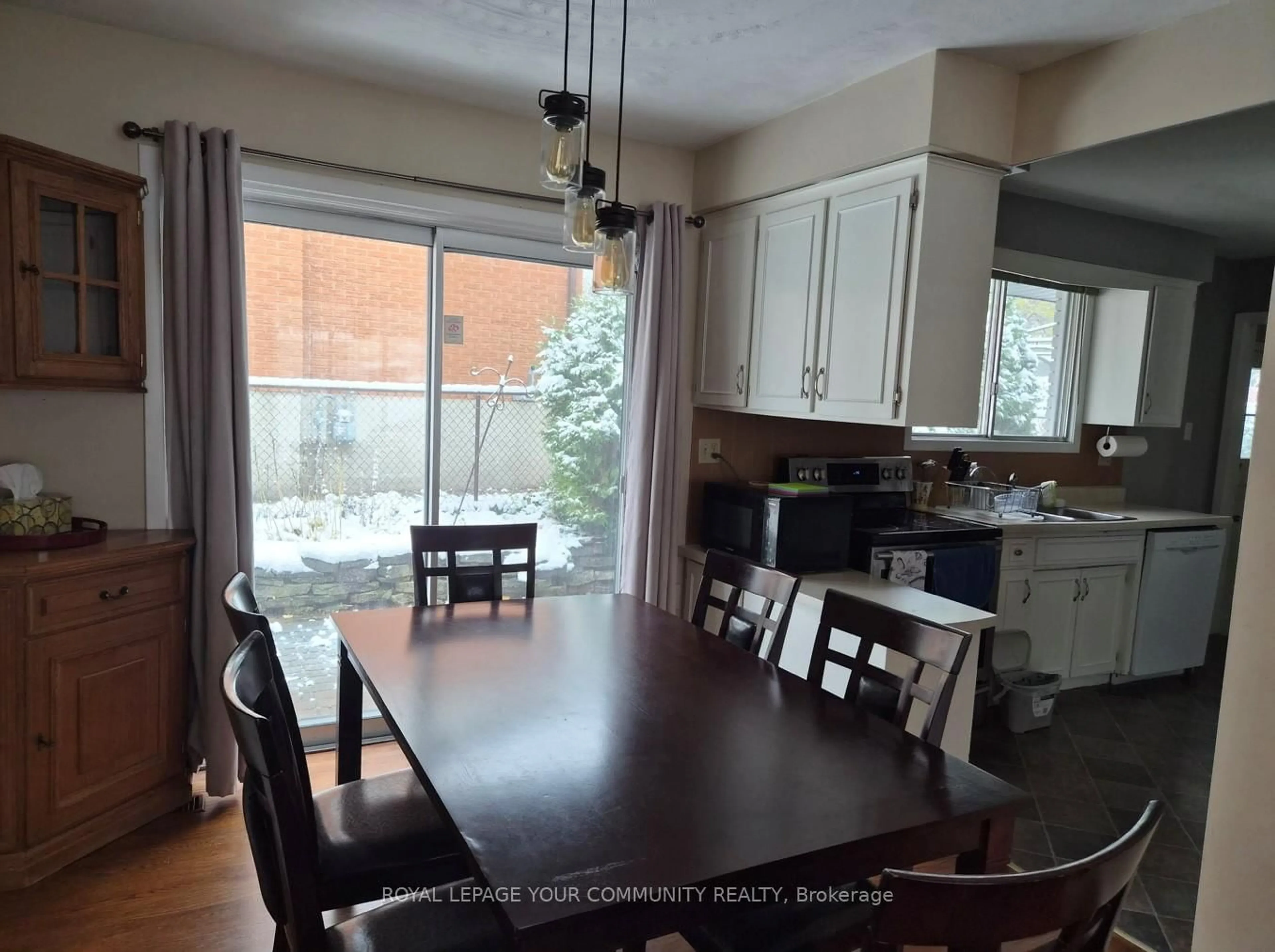 Dining room, wood/laminate floor for 557 Glen Manor Blvd, Waterloo Ontario N2L 4T7