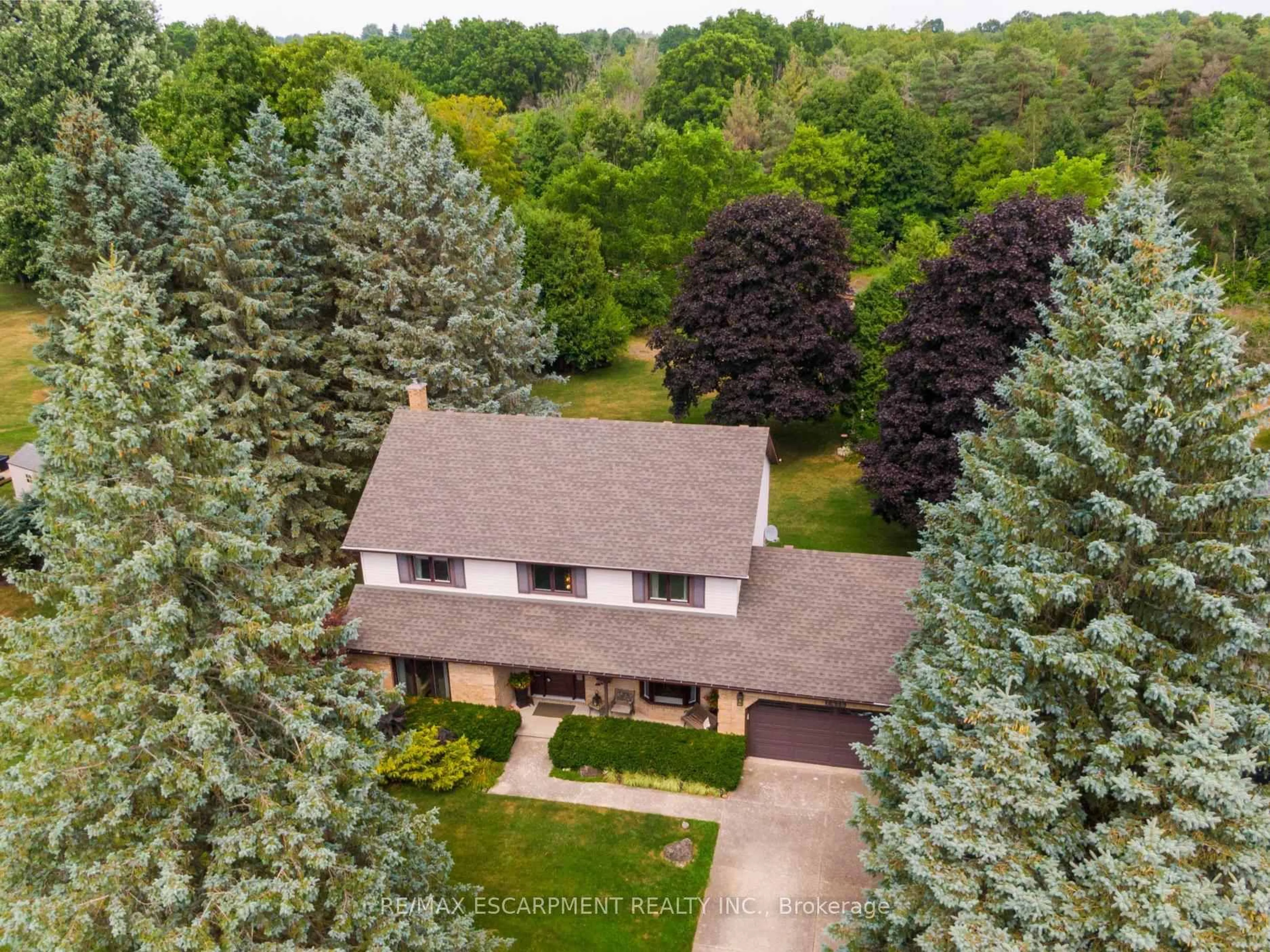 A pic from outside/outdoor area/front of a property/back of a property/a pic from drone, forest/trees view for 1416 Progreston Rd, Hamilton Ontario L0R 1H3