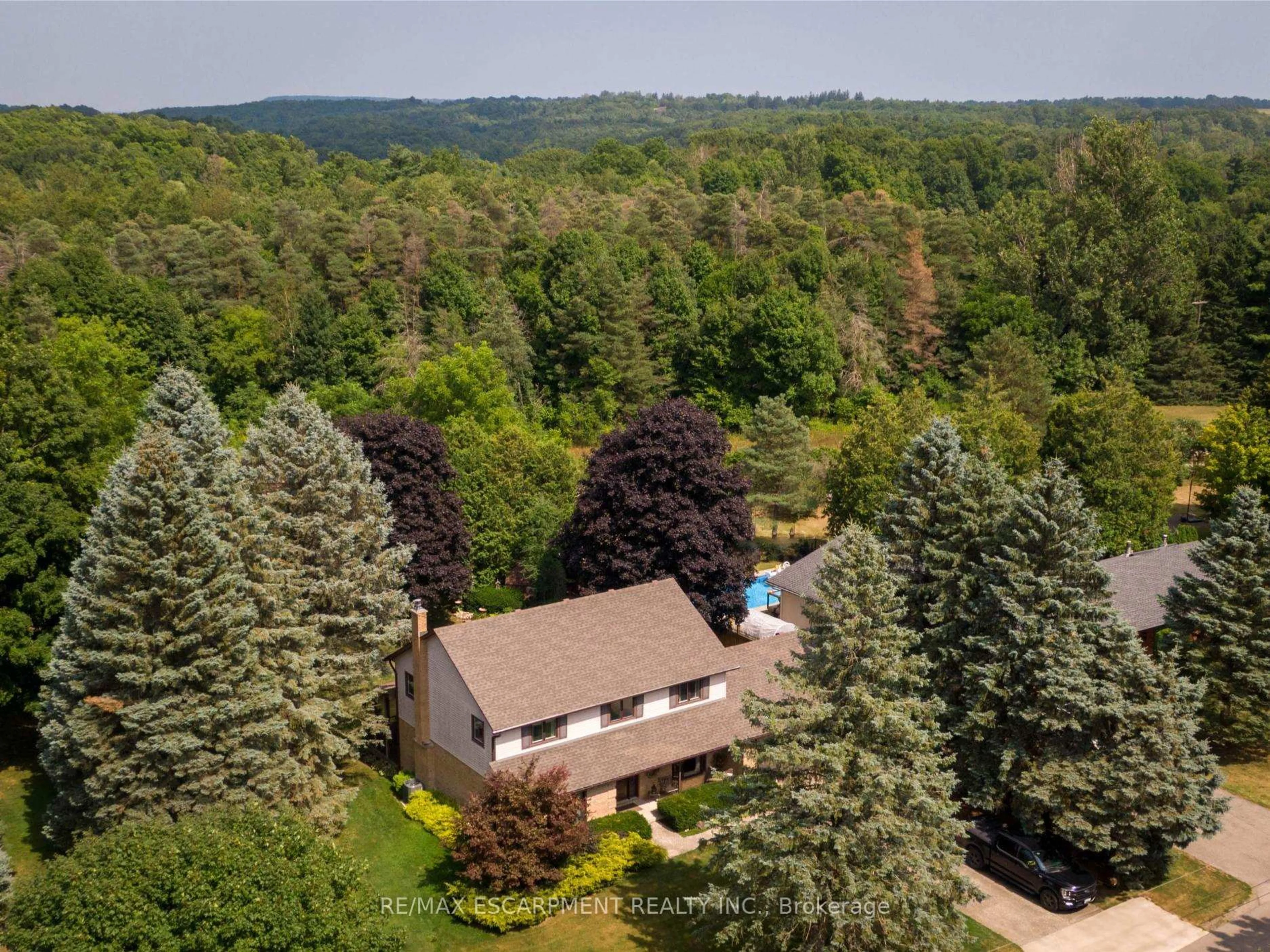 A pic from outside/outdoor area/front of a property/back of a property/a pic from drone, forest/trees view for 1416 Progreston Rd, Hamilton Ontario L0R 1H3