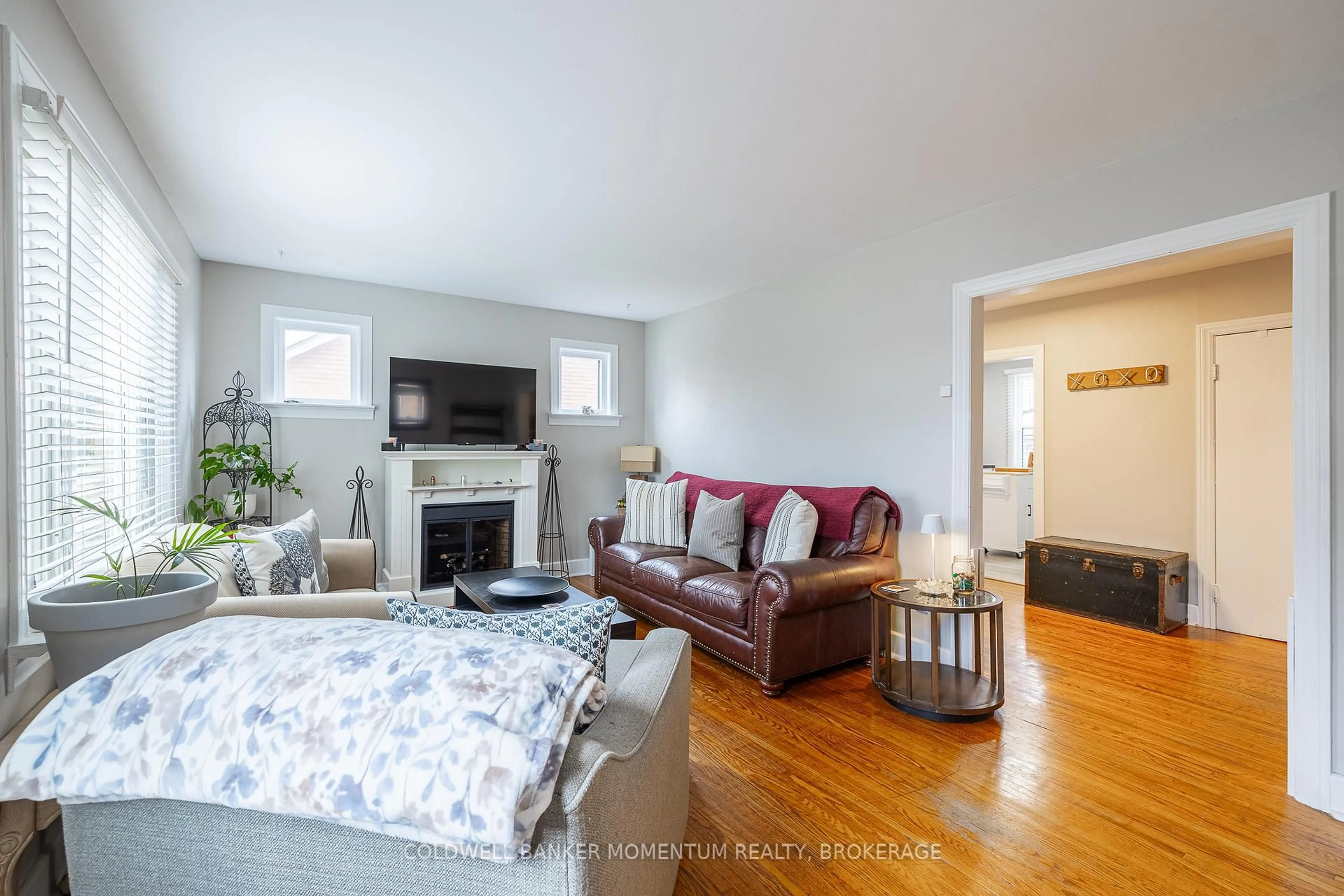 Living room with furniture, wood/laminate floor for 46 Harold Ave, Welland Ontario L3B 1J5