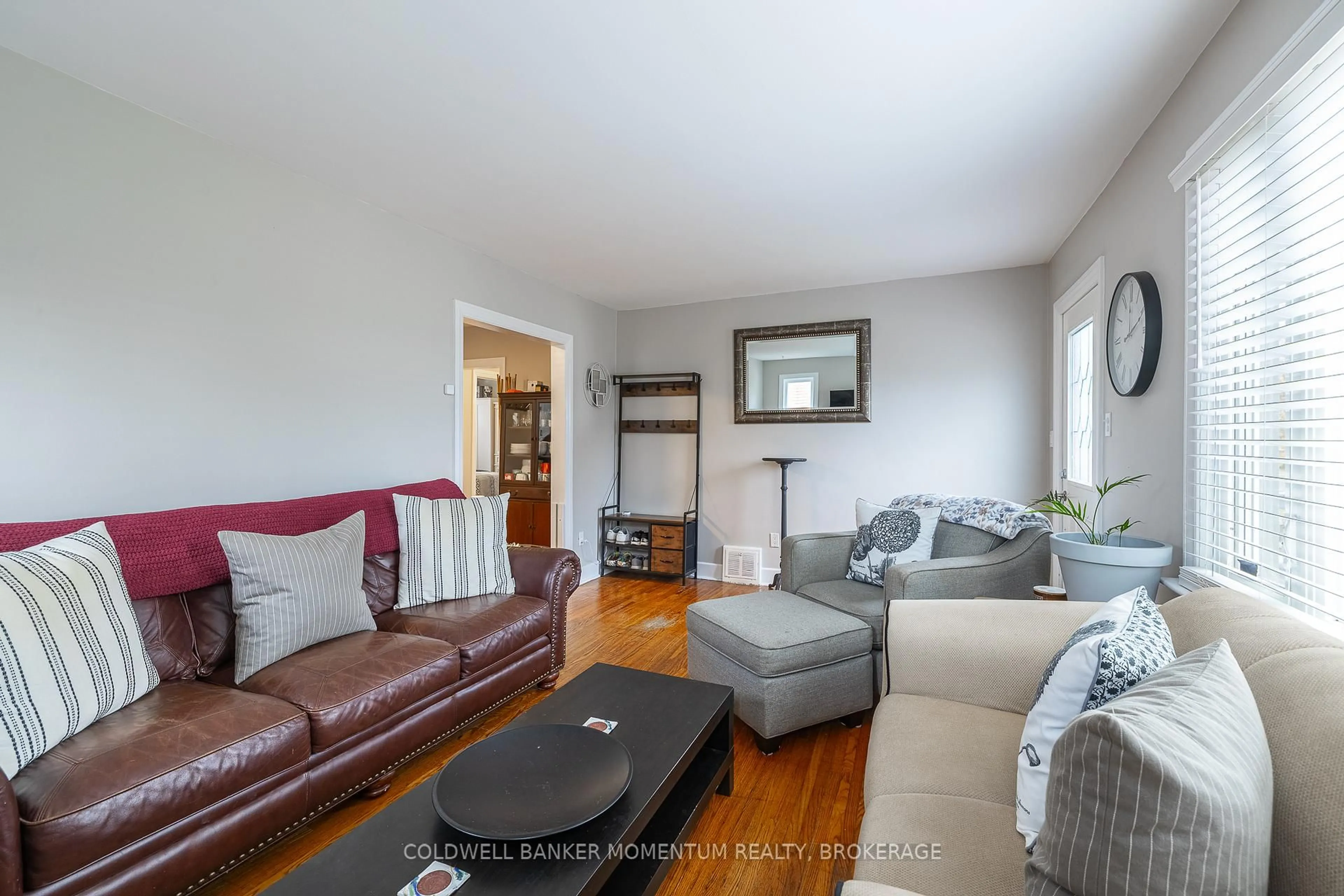 Living room with furniture, wood/laminate floor for 46 Harold Ave, Welland Ontario L3B 1J5