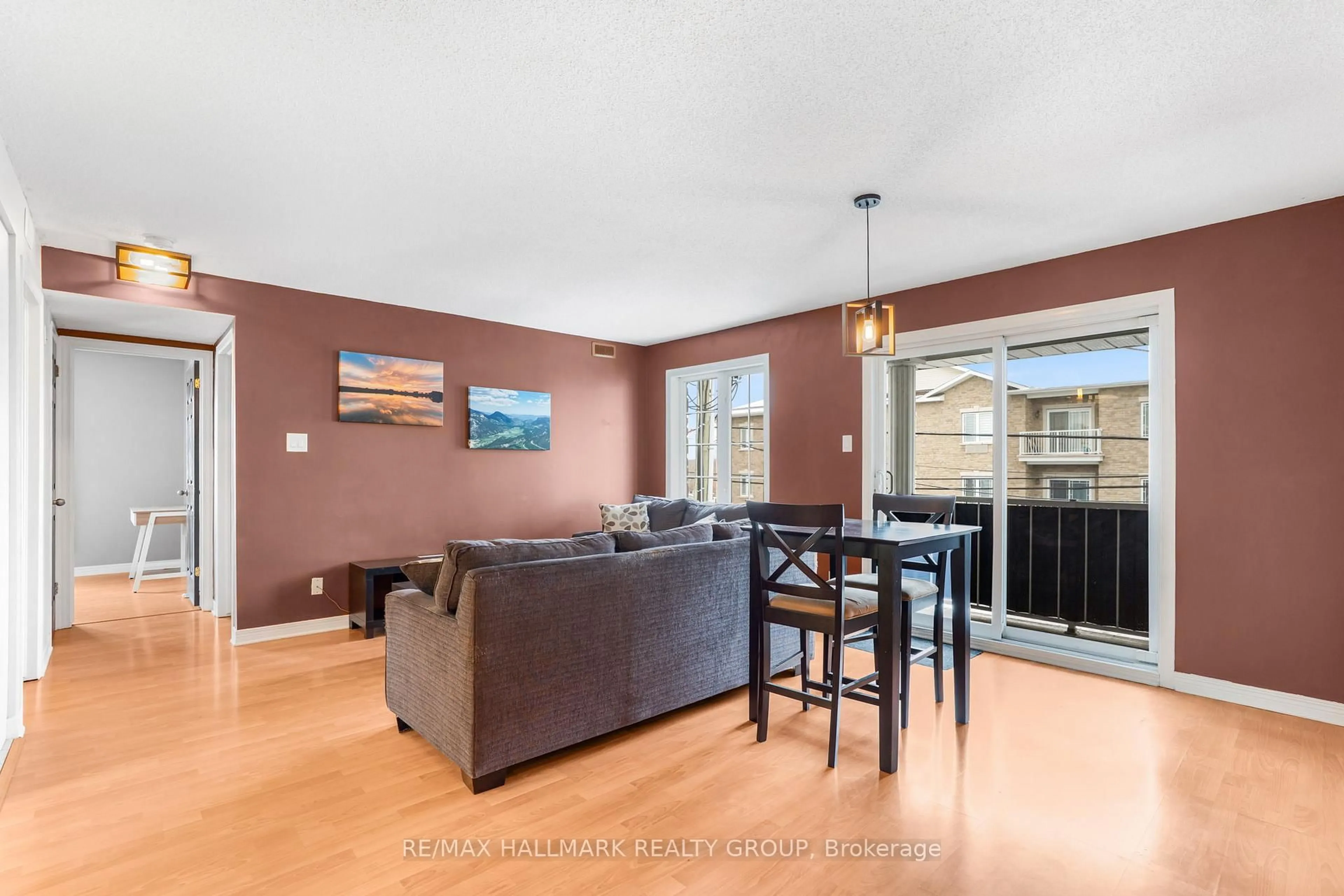 Living room with furniture, wood/laminate floor for 1005 Laurier St #302, Clarence-Rockland Ontario K4K 1T7