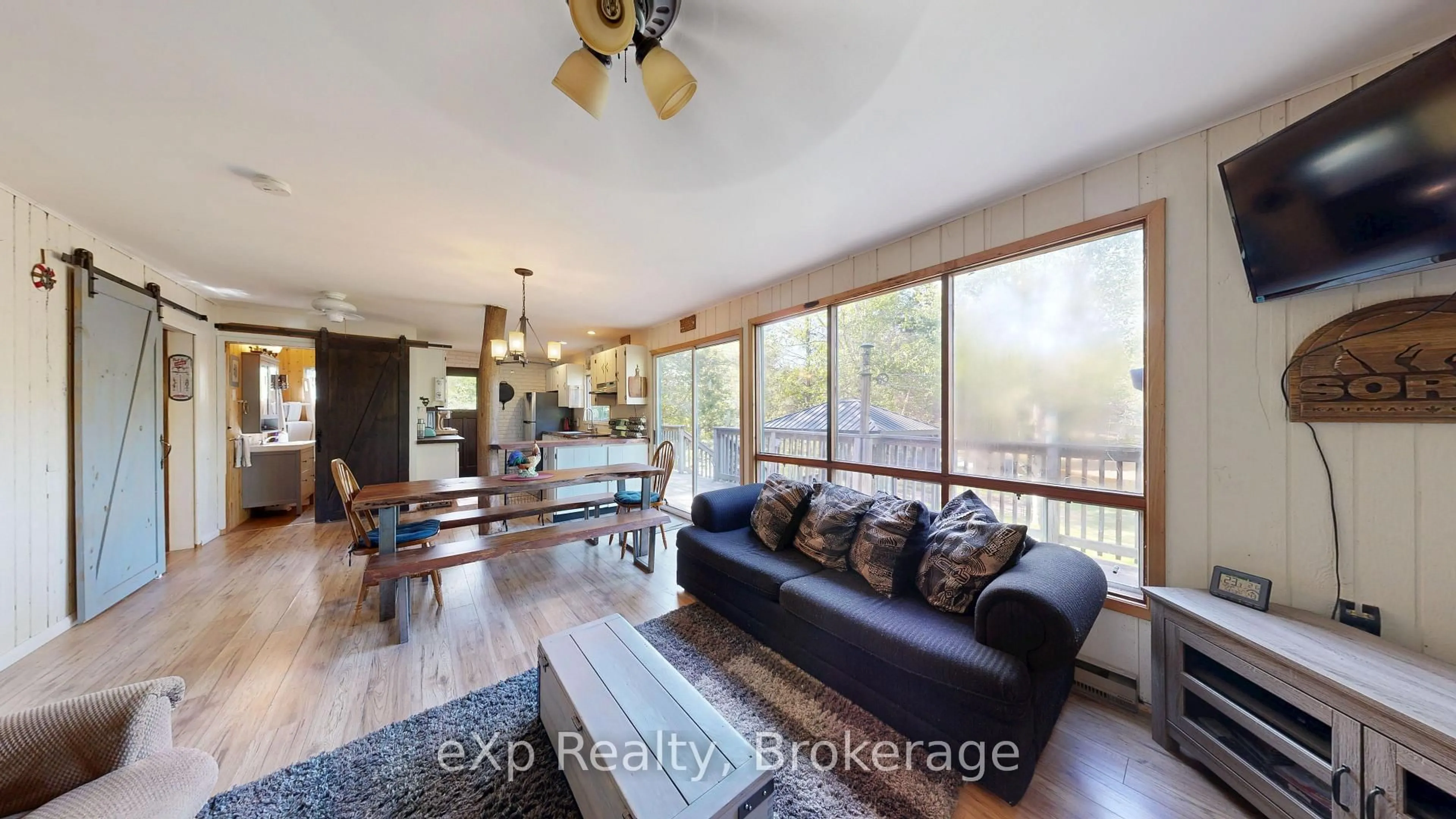 Living room with furniture, wood/laminate floor for 508 Skerryvore Community Rd, The Archipelago Ontario P0G 1G0