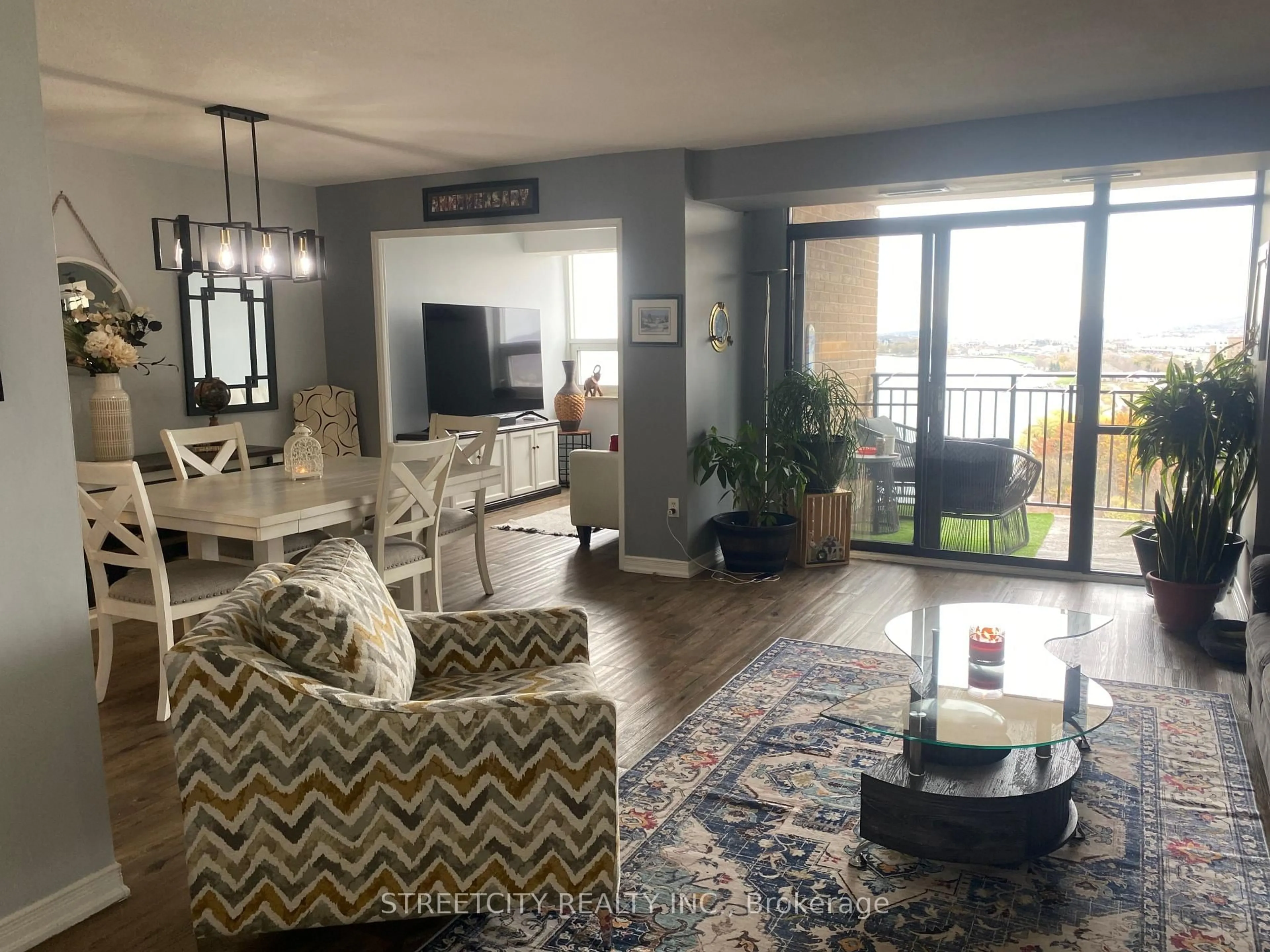 Living room with furniture, unknown for 500 Green Rd #1607, Hamilton Ontario L8E 3M6