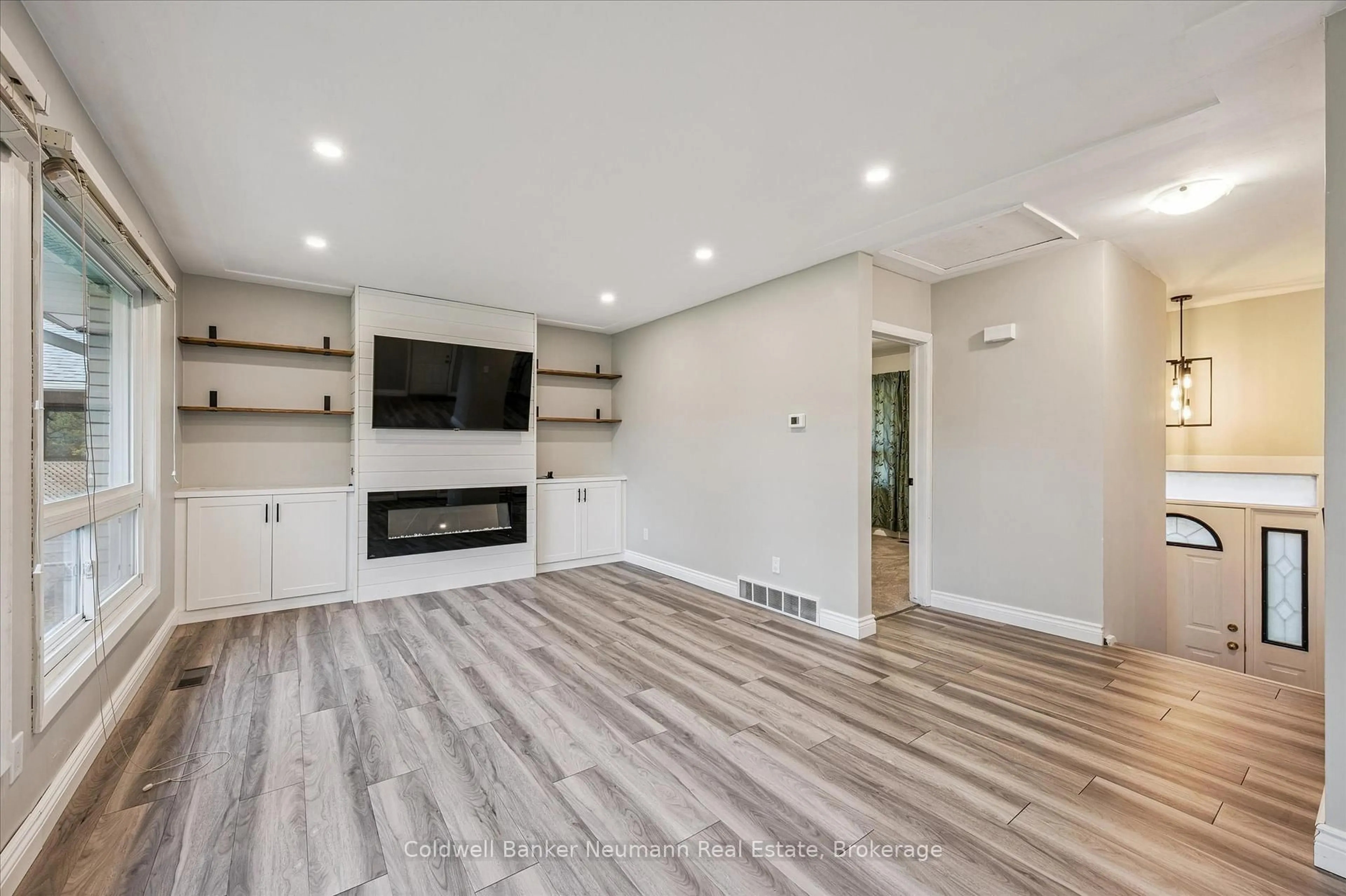 Living room with furniture, wood/laminate floor for 127 Avon Rd, Kitchener Ontario N2B 1T9