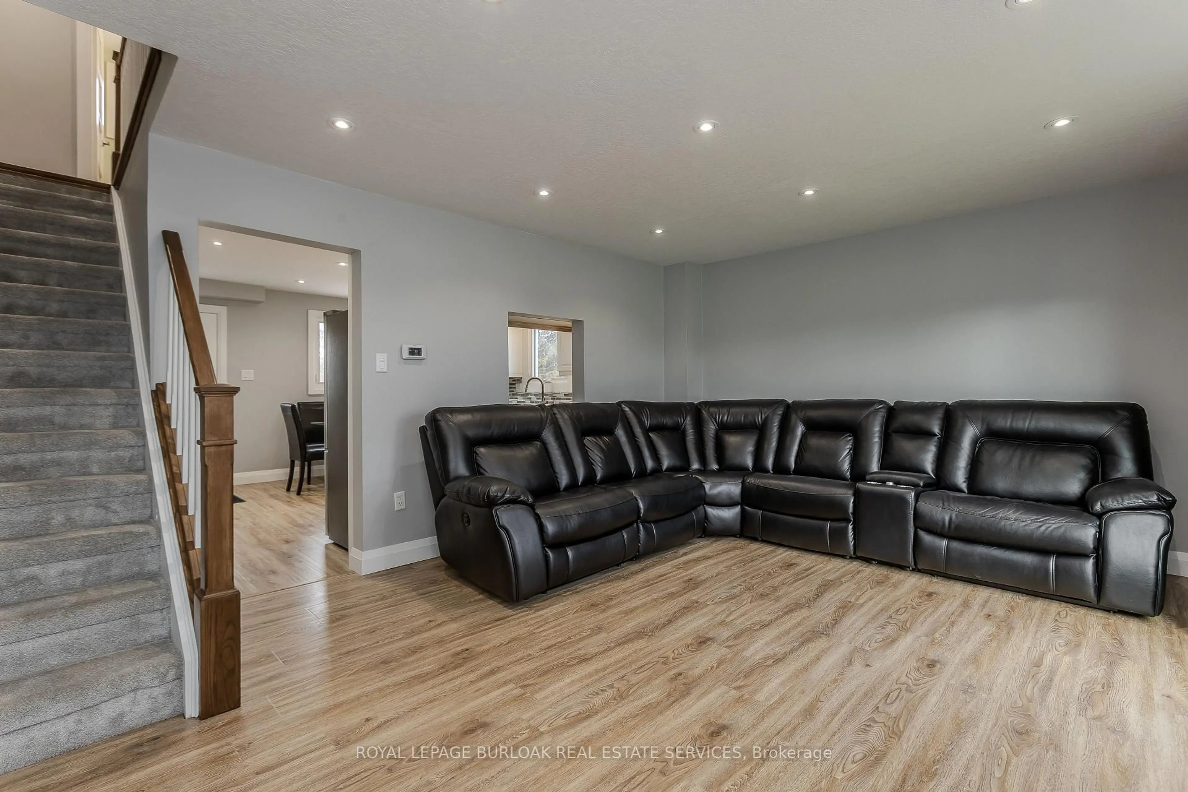 Living room with furniture, wood/laminate floor for 30 Graywood Rd, Hamilton Ontario L9C 6K4