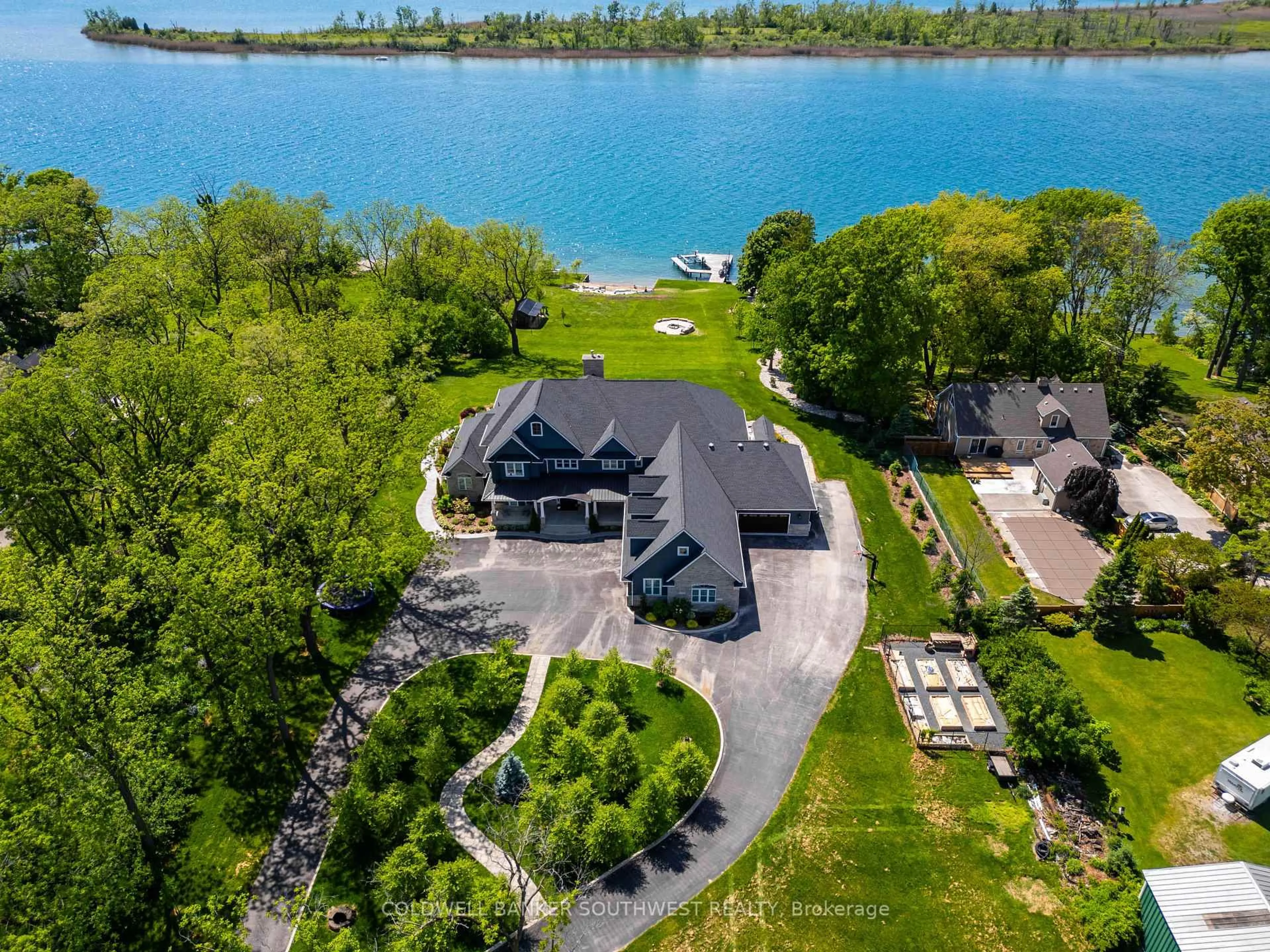 A pic from outside/outdoor area/front of a property/back of a property/a pic from drone, water/lake/river/ocean view for 647 St Clair Pkwy, St. Clair Ontario N0N 1G0