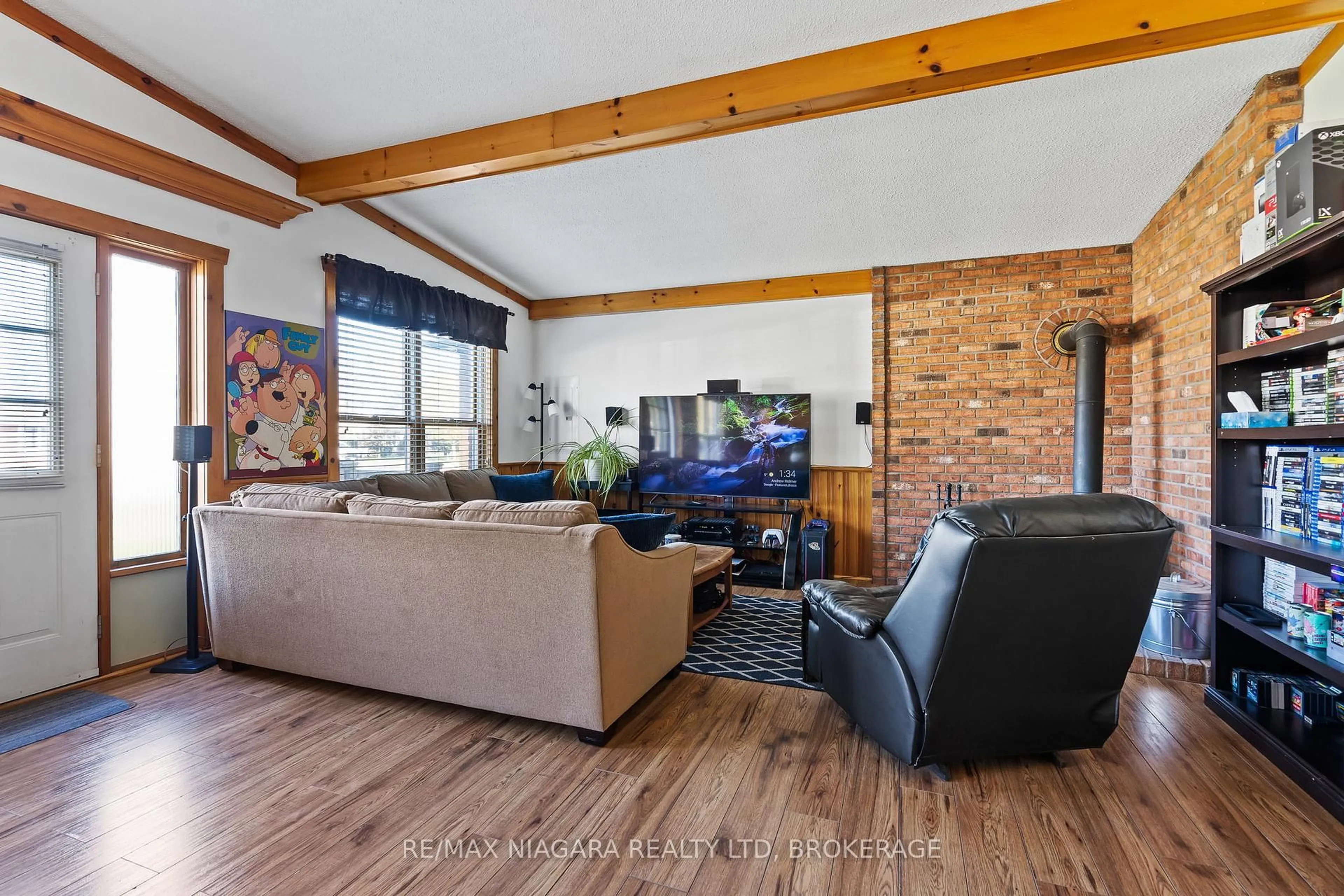 Living room with furniture, wood/laminate floor for 3465 EAST MAIN St, Fort Erie Ontario L0S 1S0